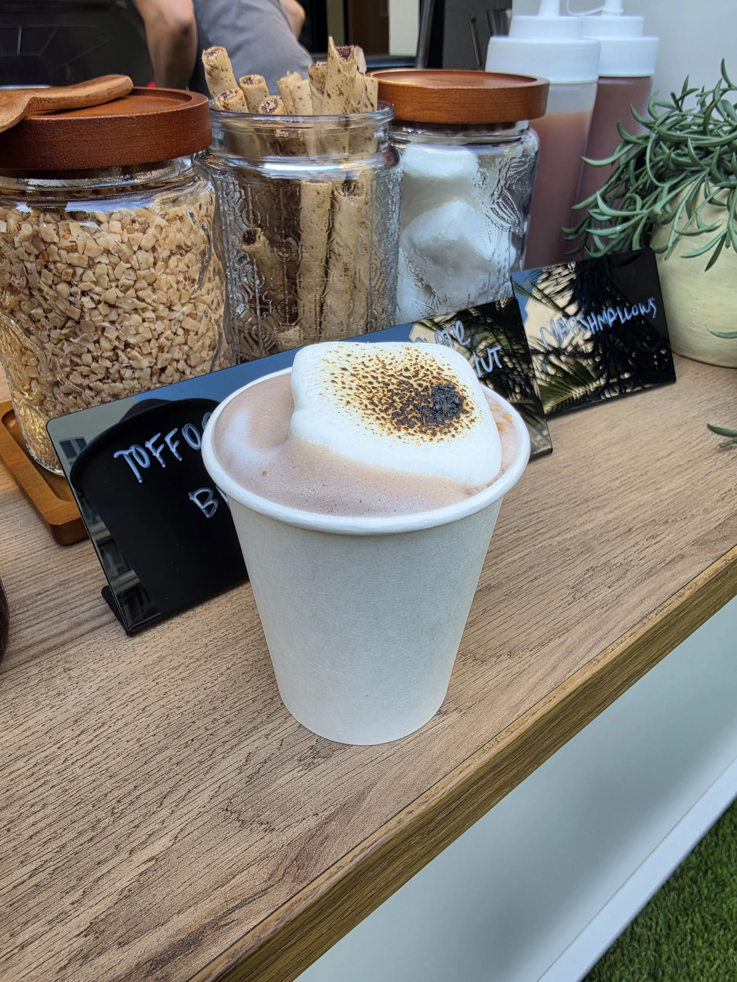 Hot chocolate topped with a torched marshmallow at a Pulo Coffee hot chocolate cart catering event in Los Angeles