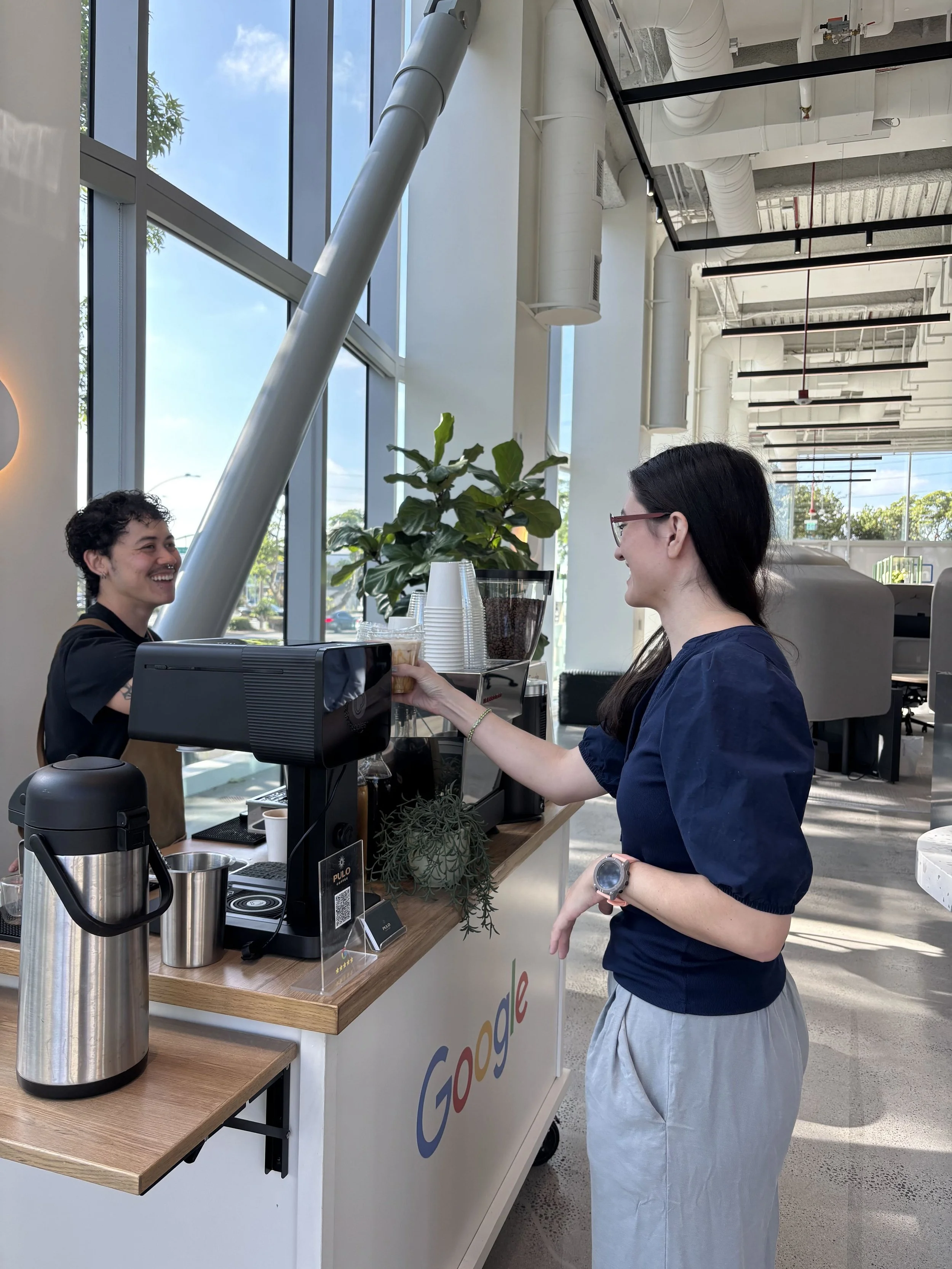 Pulo Coffee barista serving guest at Google branded coffee cart at Los Angeles corporate office event