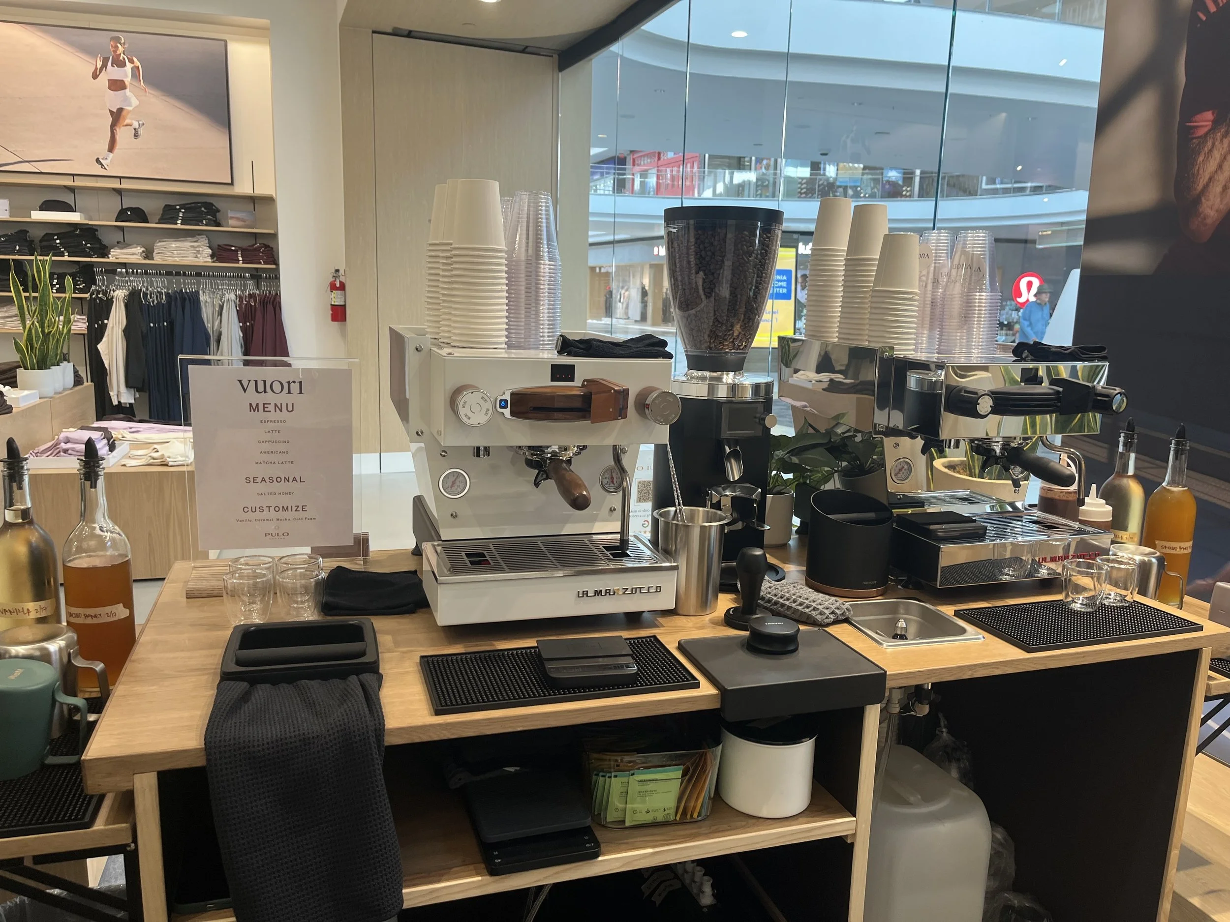 Barista preparing espresso machine during mobile coffee cart catering setup for an event