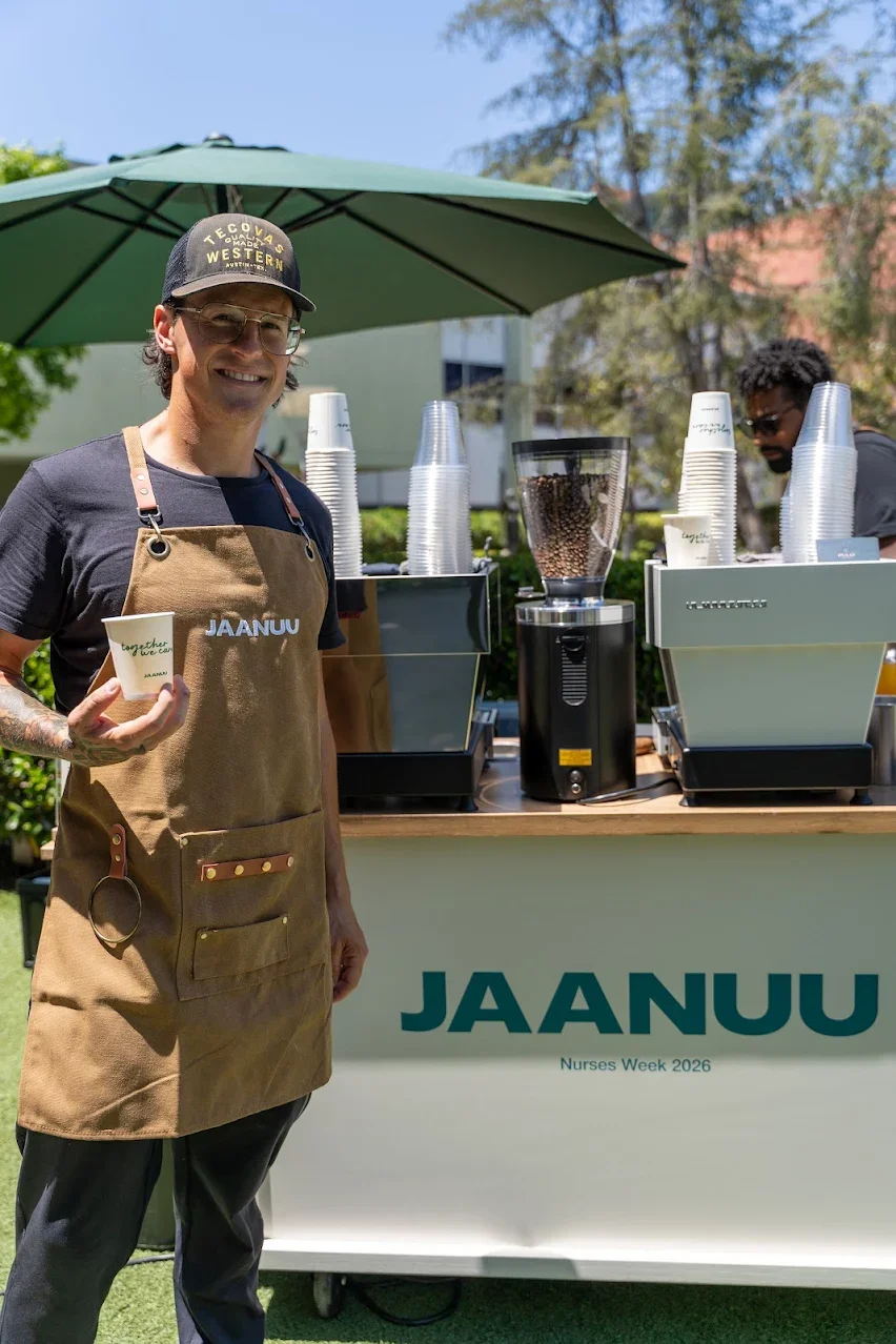 Pulo Coffee barista serving Jaanuu branded coffee at outdoor corporate event for Nurses Week Los Angeles