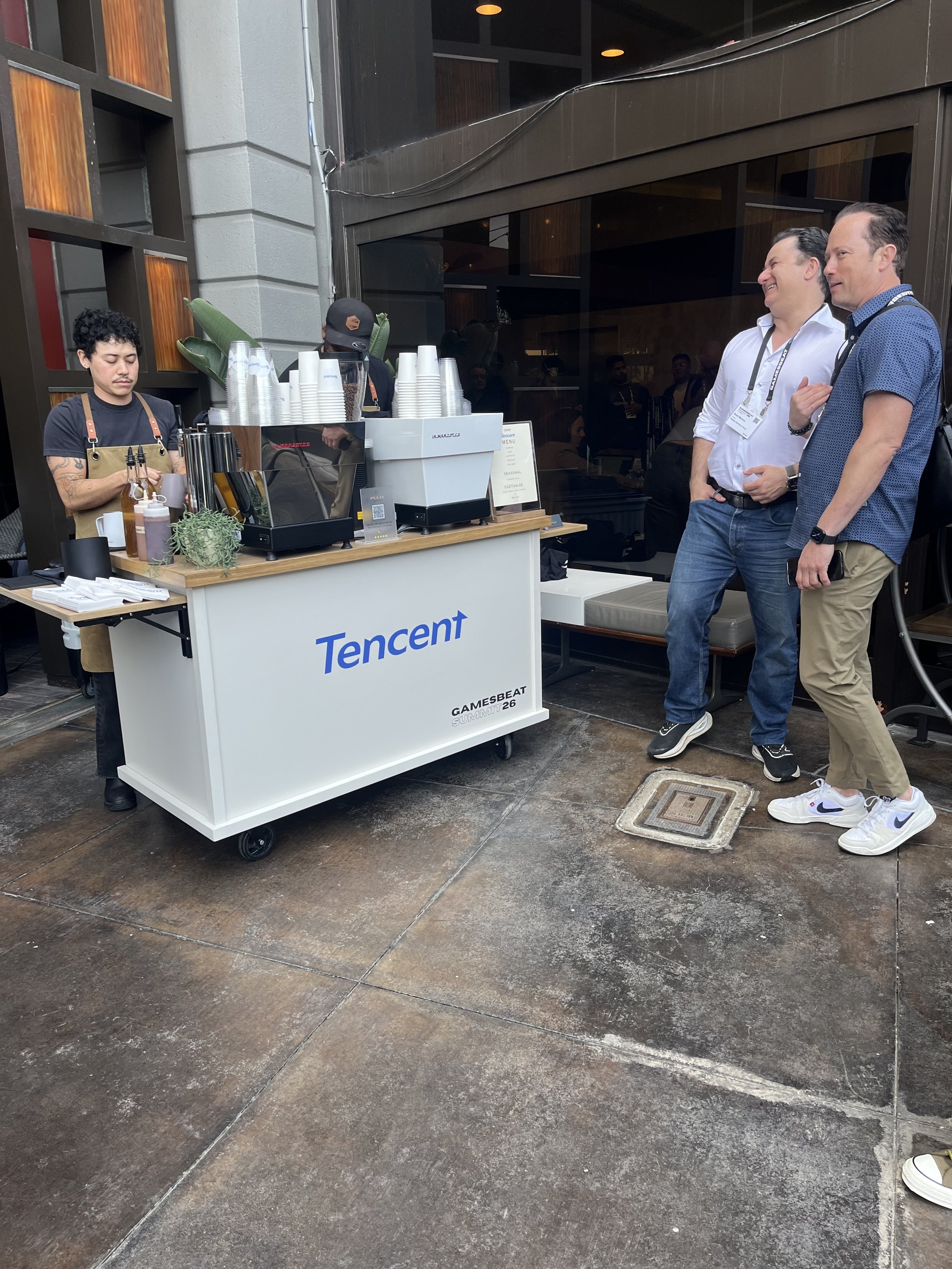 Gaming industry attendees at Pulo Coffee branded Tencent coffee cart during GamesBeat Summit 2026 in Marina del Rey Los Angeles