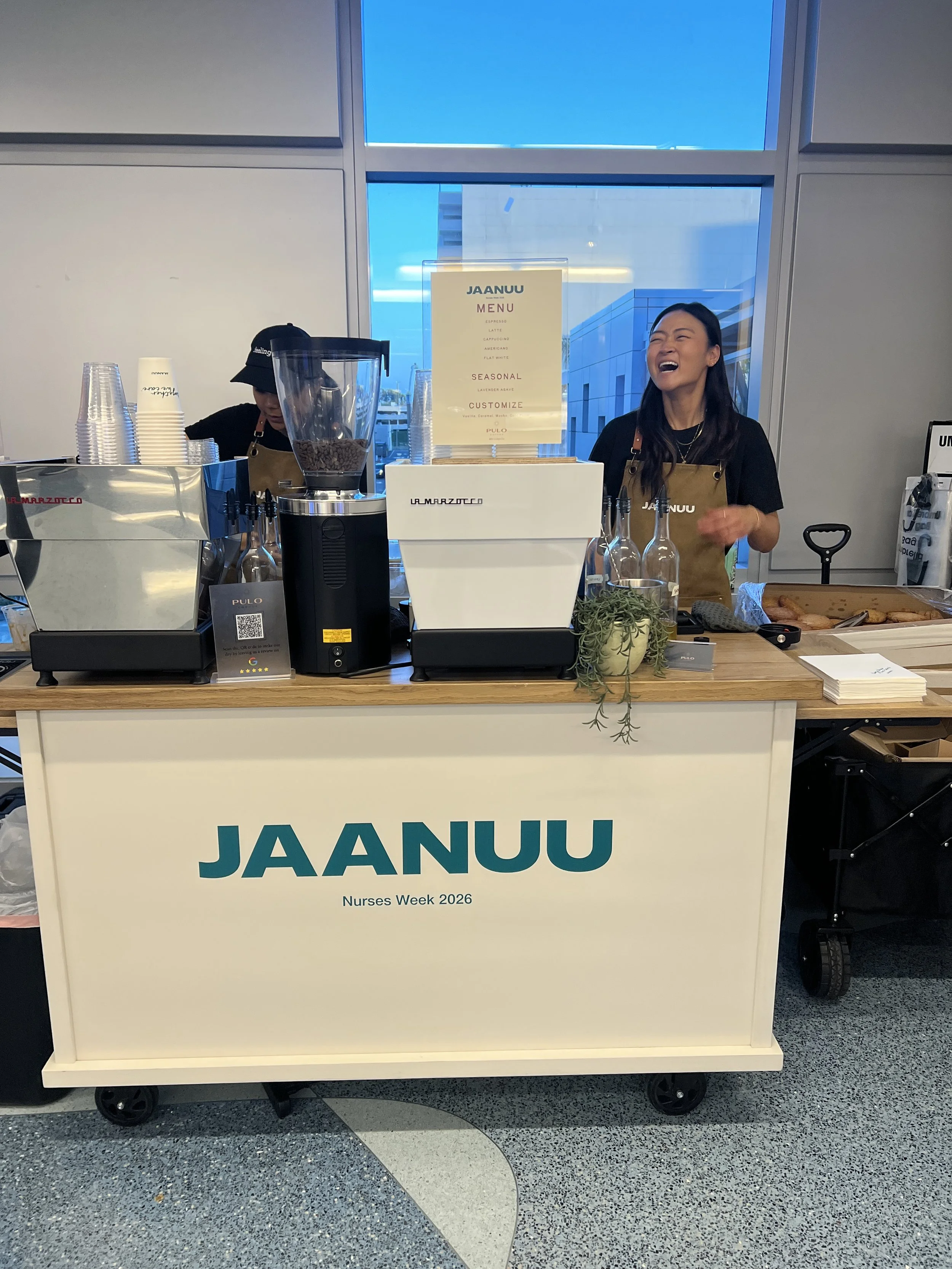 Pulo Coffee barista serving specialty espresso at JAANUU branded coffee cart event in Los Angeles