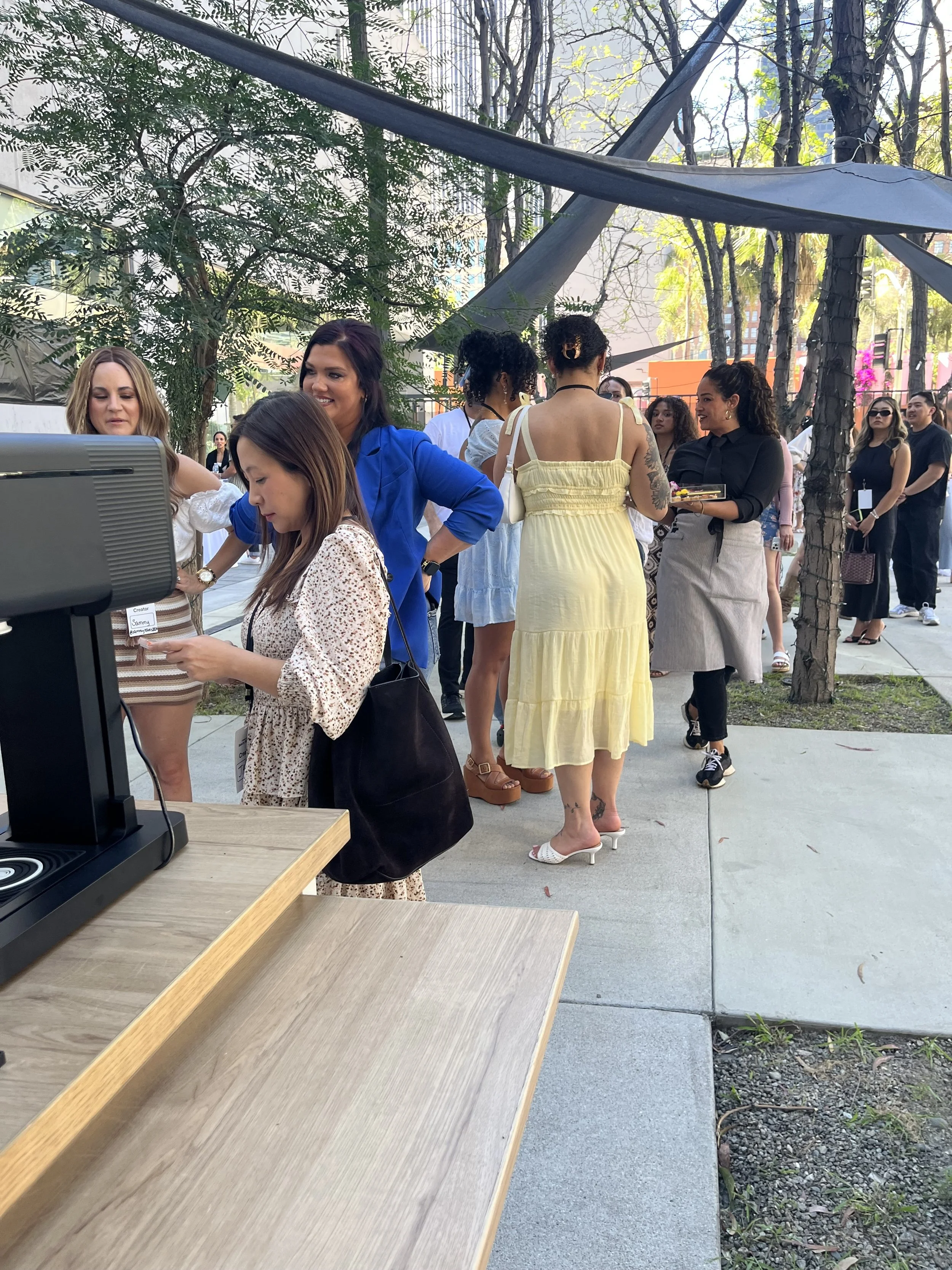 Guests lining up at Pulo Coffee matcha bar during TikTok Shop Beauty Besties outdoor brand activation in Los Angeles