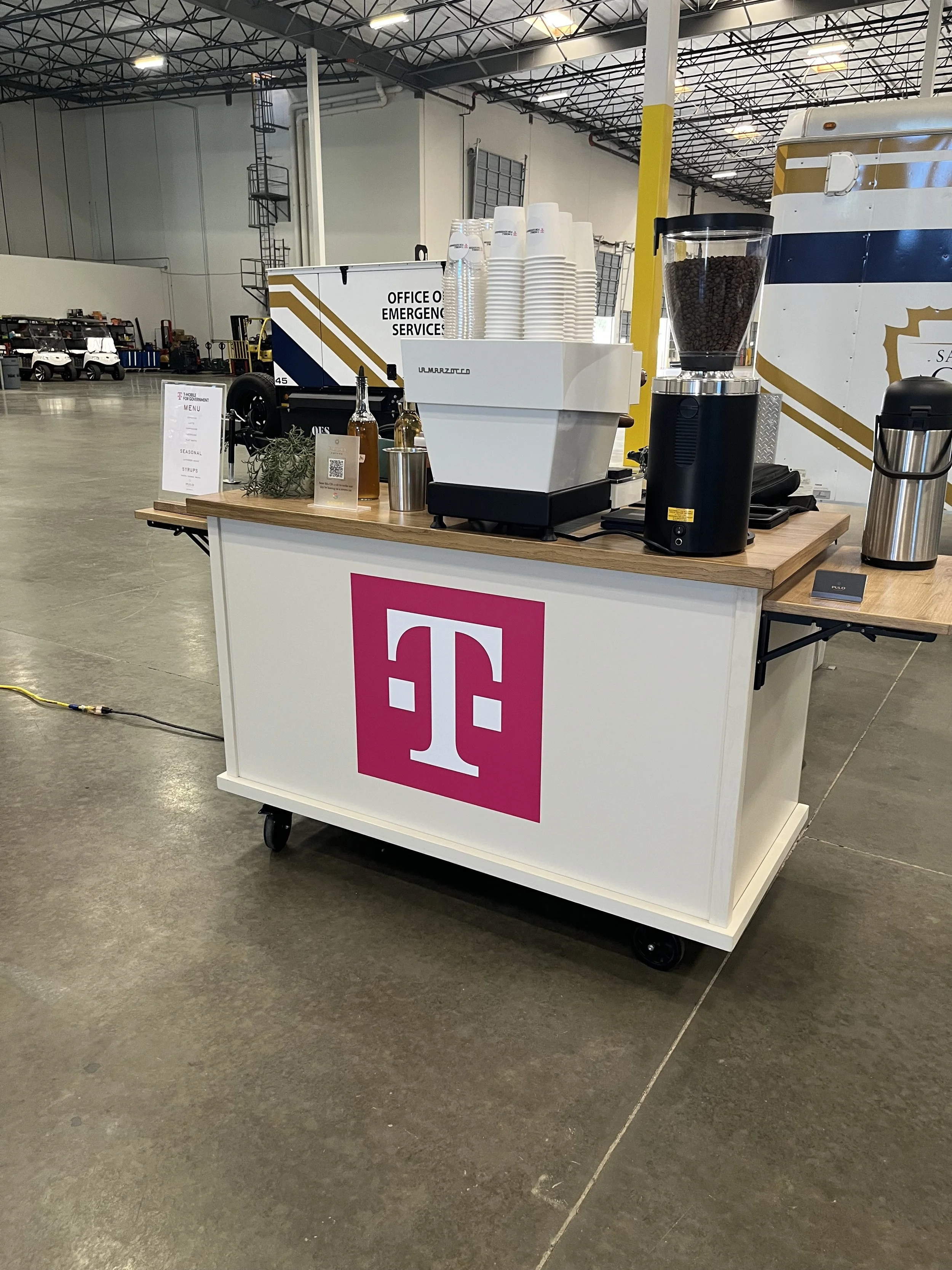 Pulo Coffee branded coffee cart with T-Mobile wrap at Los Angeles corporate event