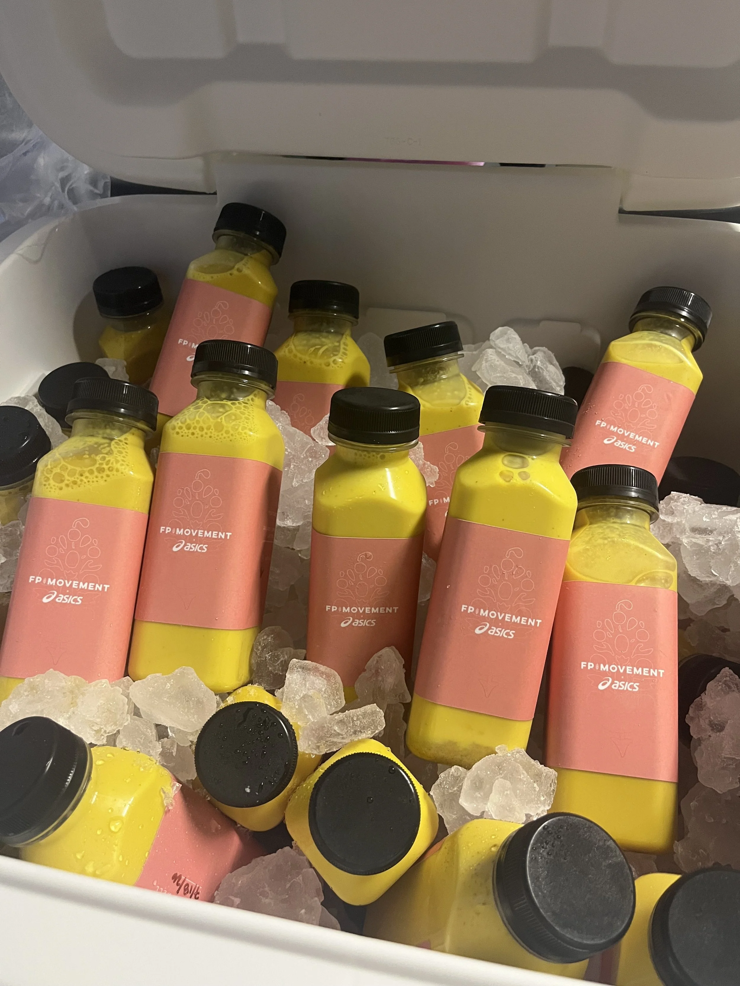 Pulo Coffee custom branded bottled lattes packed in insulated cooler with ice for outdoor event delivery in Los Angeles