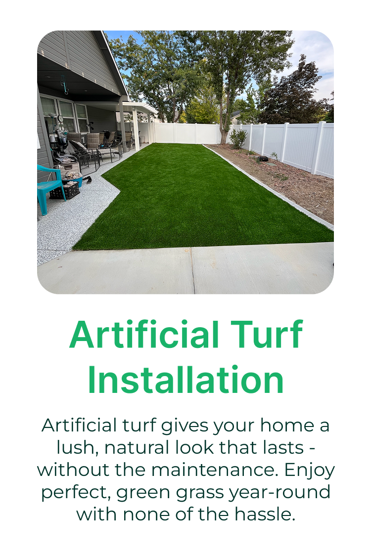 Backyard with artificial turf, patio furniture, and a white fence, with some trees in the background and a partly cloudy sky.