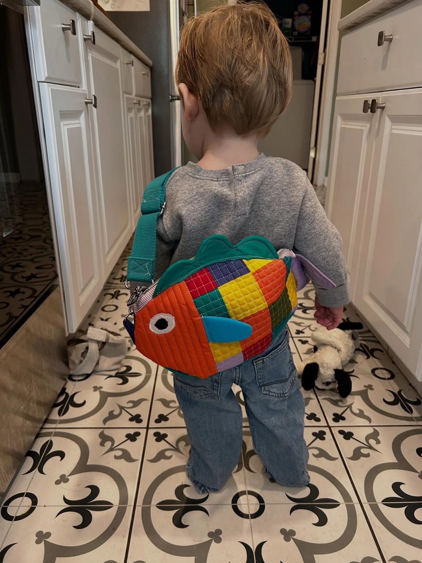 My son ready for his next big adventure with his fish bag. 

What&rsquo;s inside:
A model bumblebee 
Rubber ball 
A sequin 
Toy dump truck 

#madebymom #homemade #sew #bagsofinstagram #fishbag