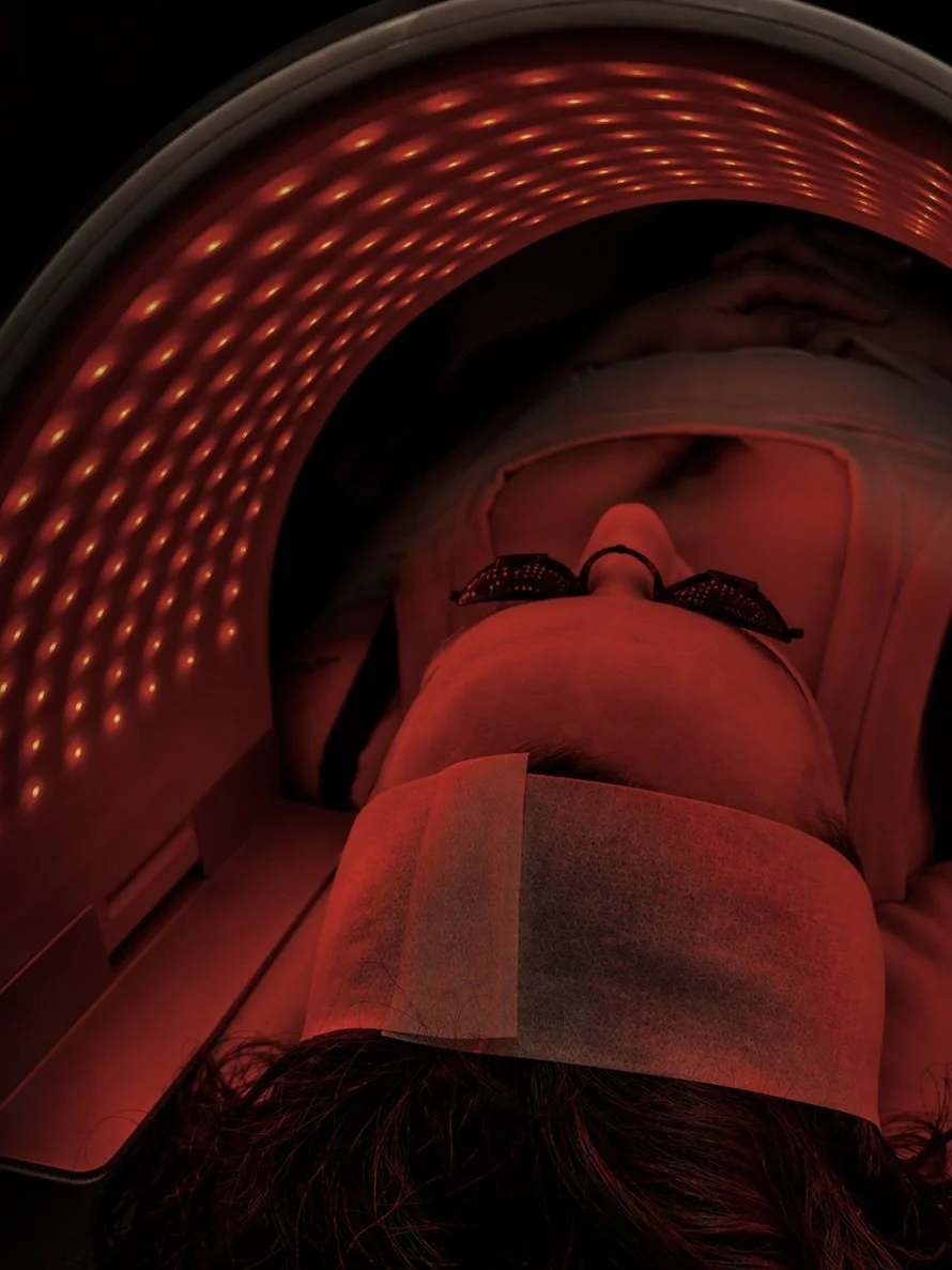 Client receiving LED light therapy during a facial treatment at Éclat & Co. in Omaha