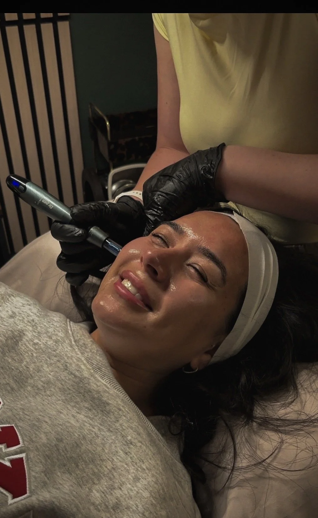 Omaha esthetician performing an advanced microneedling facial treatment at Éclat & Co. in Omaha