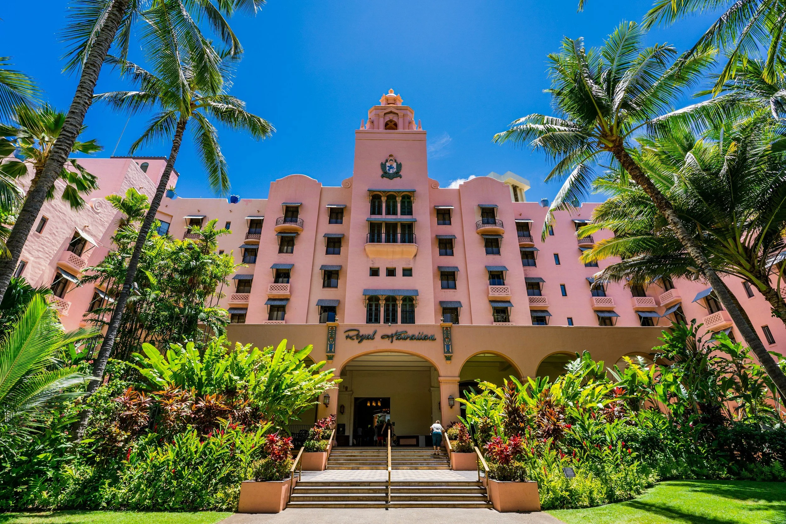 The Royal Hawaiian Hotel with lush  tropical landscaping