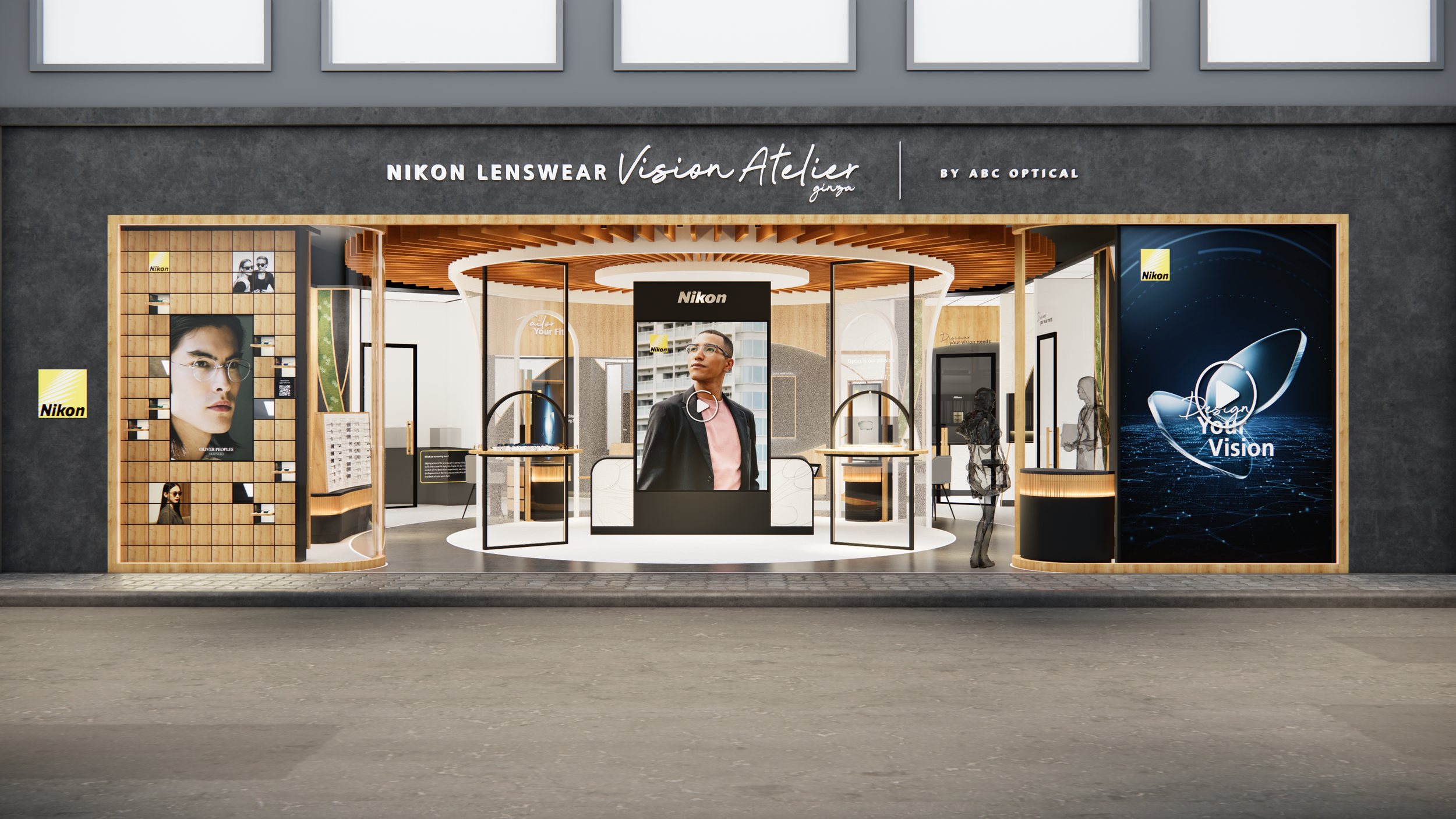 Storefront display for Nikon Lenswear Vision Atelier, featuring mannequins and promotional images of glasses, with large digital screens and product displays inside.