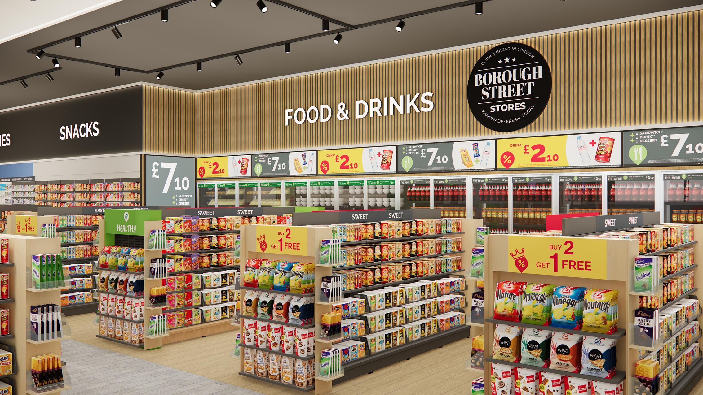 Interior of a supermarket aisle with shelves stocked with snacks, food, and drinks. Signage indicates sections for snacks and food & drinks, with promotional signs offering deals like buy 2 get 1 free and prices for various items.