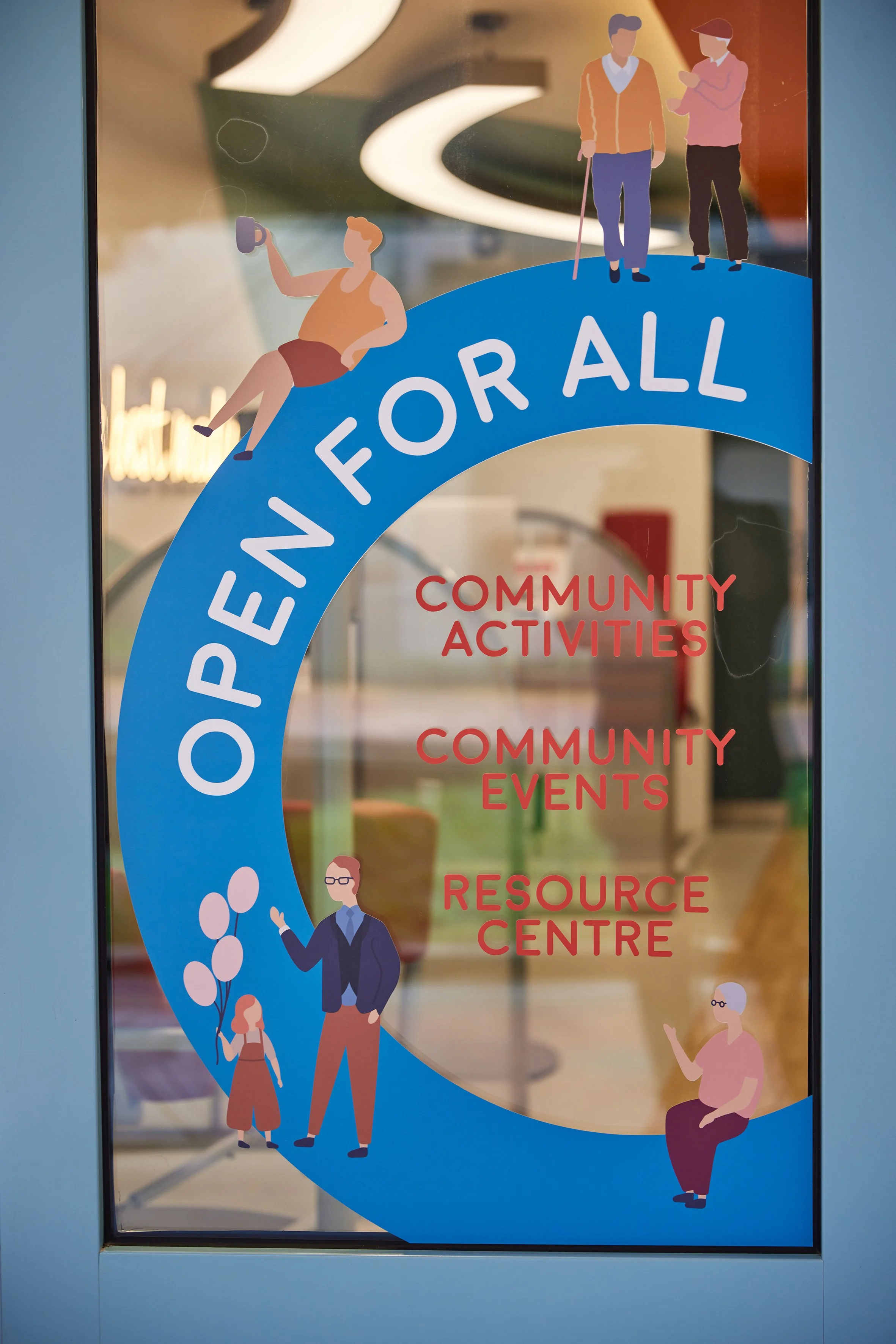 Posters for community activities, events, and resources, with illustrations of diverse people engaging in various activities, on a glass door.