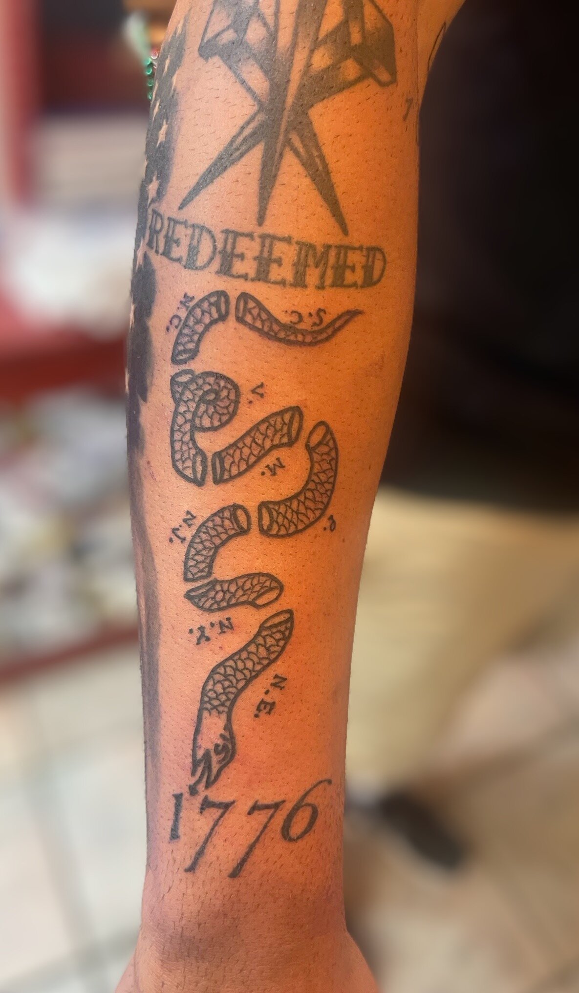 "Join or Die" forearm addition for a regular client, in black and grey.