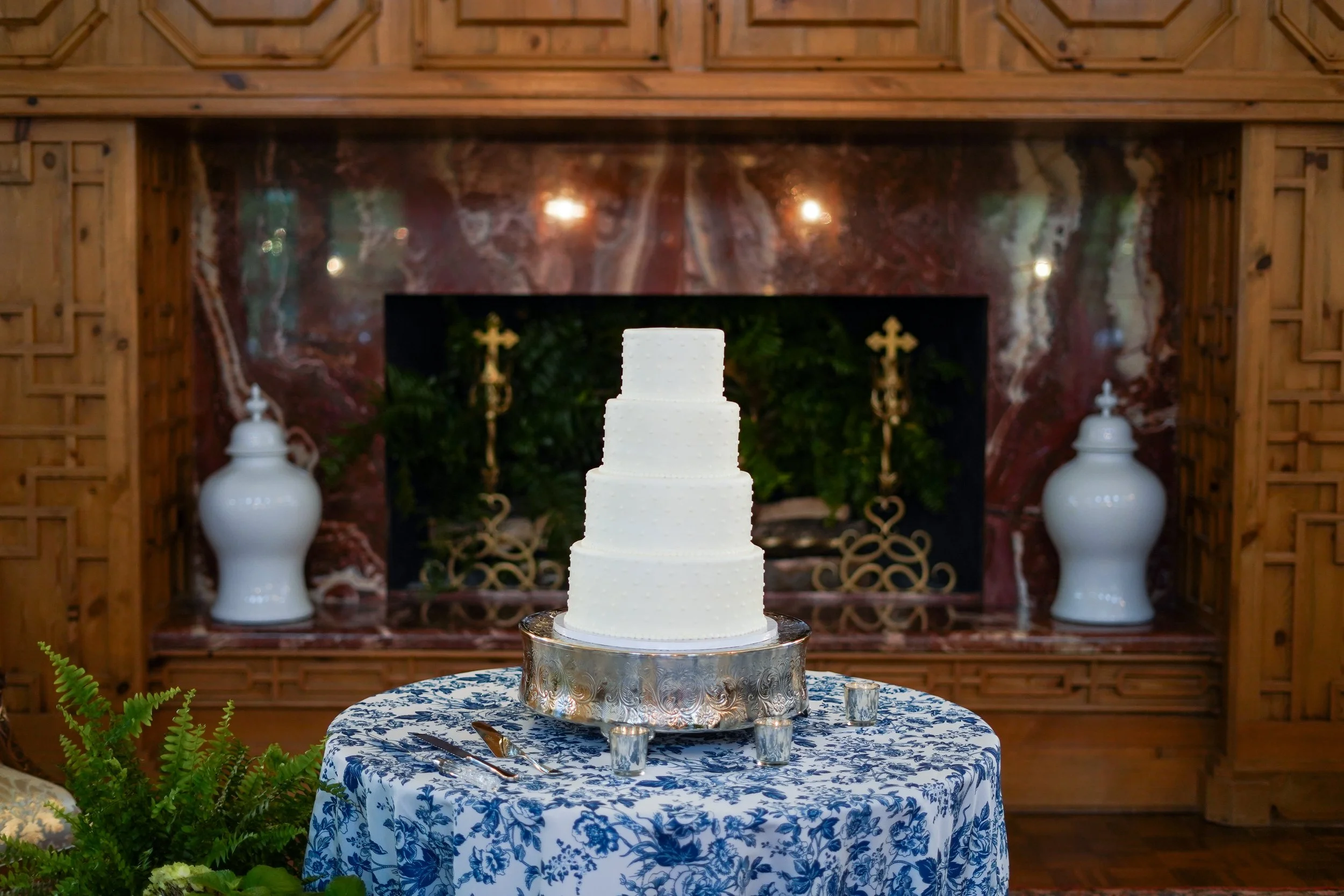 For K + J, a classically elegant 4-tier cake with  a buttercream swiss dot decoration