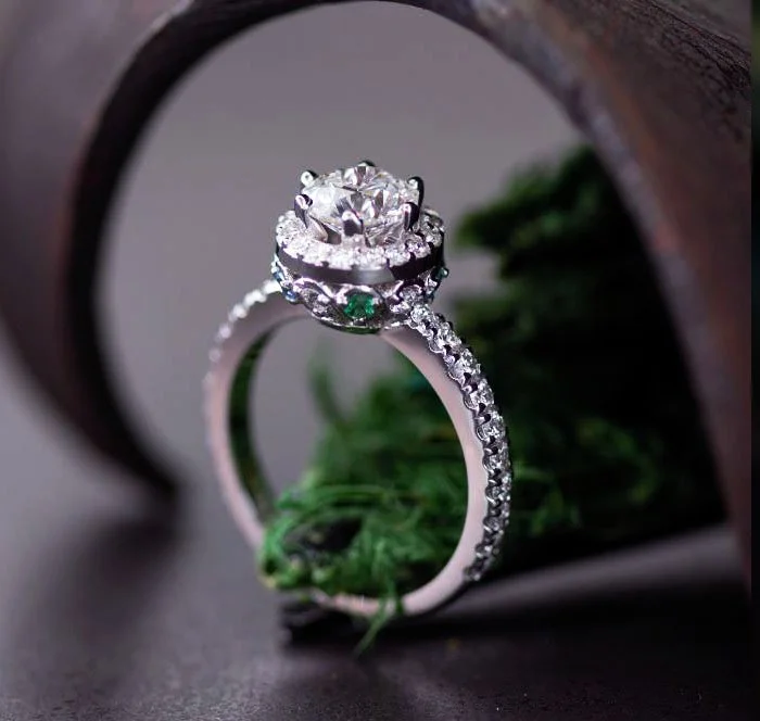 Modern three-stone engagement ring with round center diamond and side stones set in platinum – bespoke design Kaz Jewelry