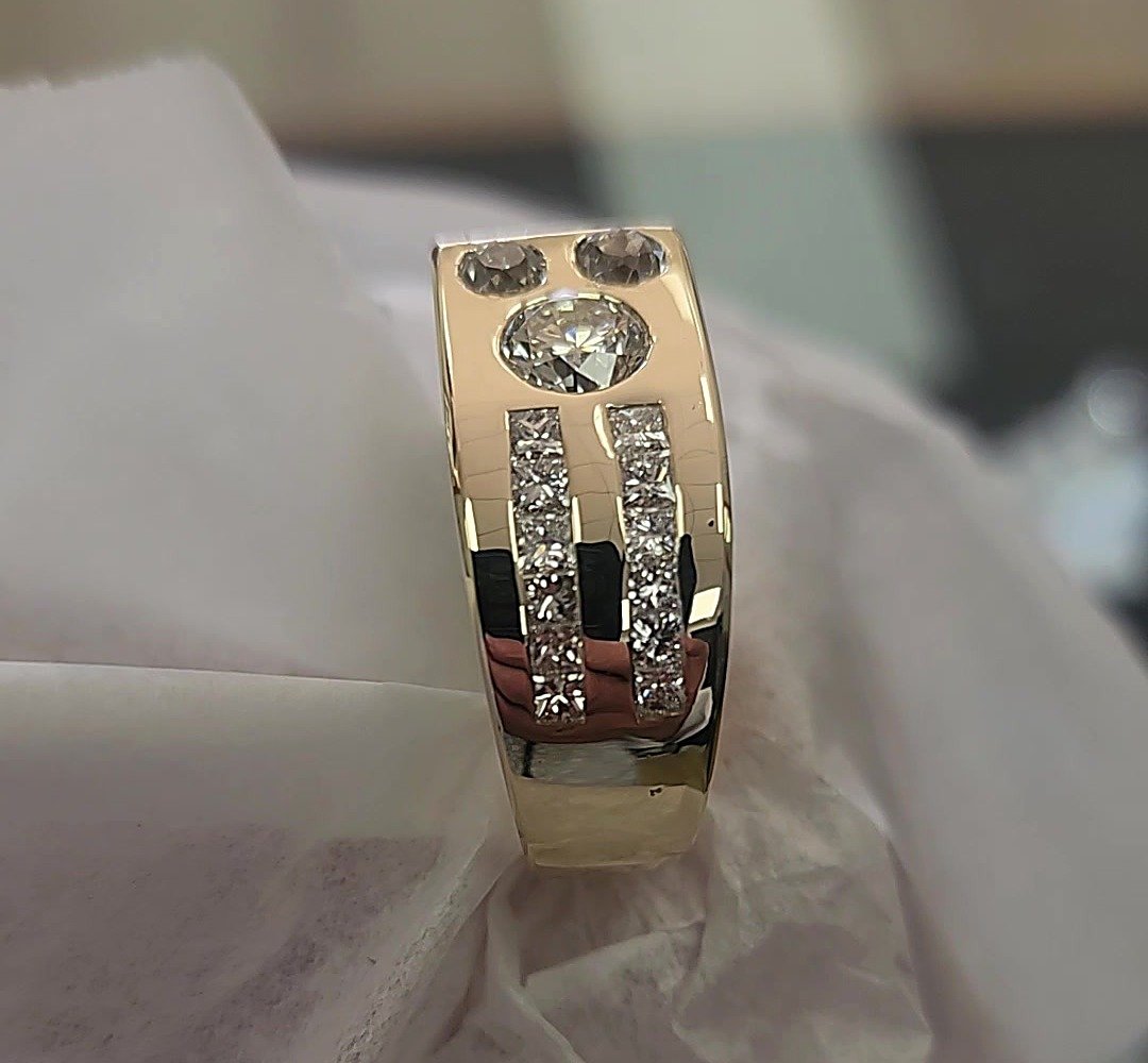 Finished custom gold ring made from client's existing diamonds, with channel-set rows, by Kaz Jewelry