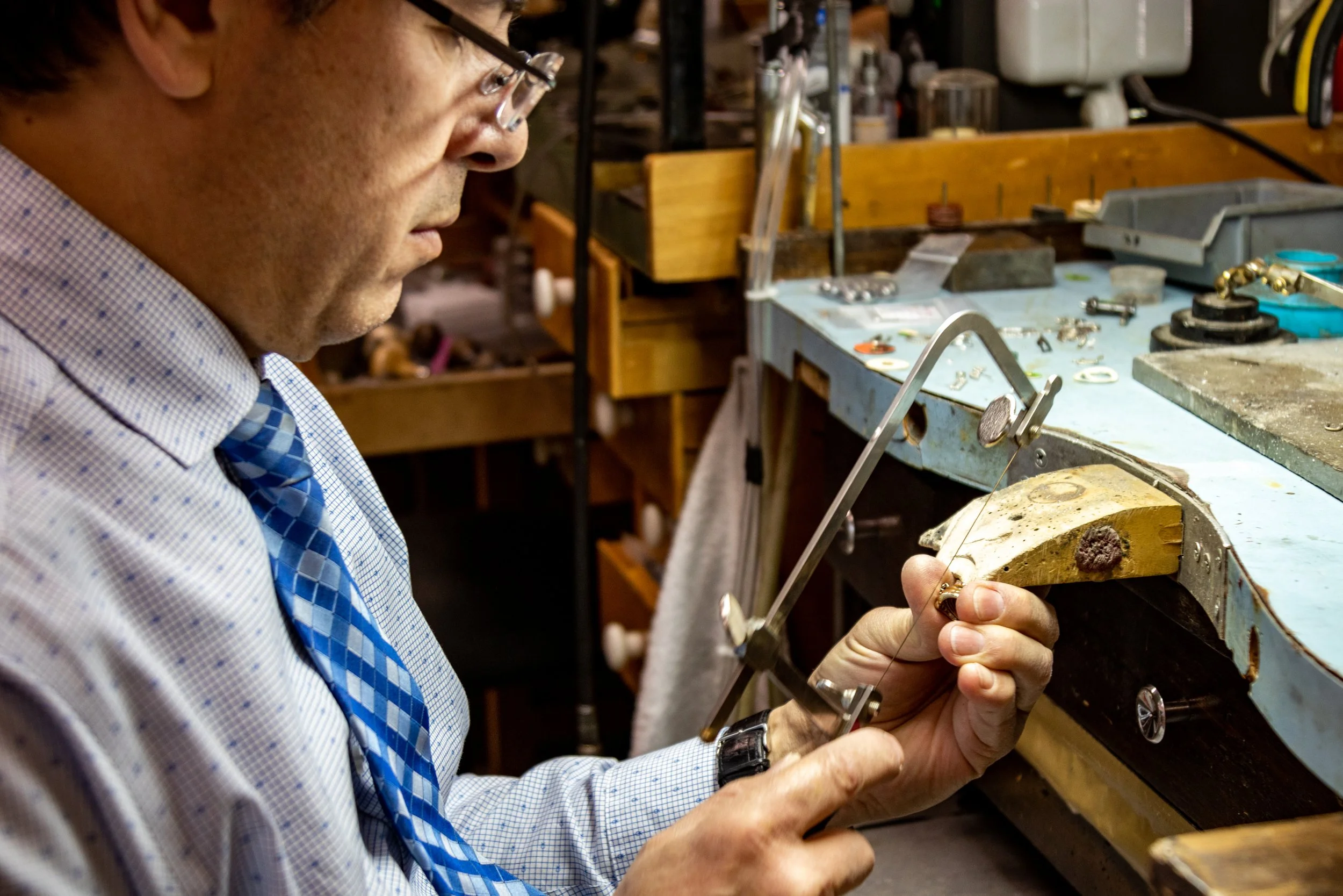 Master jeweler Albert Kaz resizing a ring at his bench in Laguna Niguel