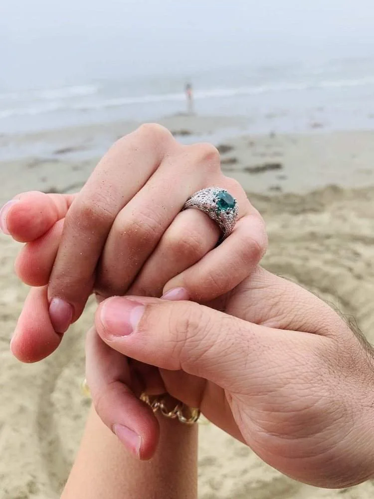 Hidden personalized details inside a custom emerald engagement ring designed by Kaz Jewelry in Laguna Niguel.