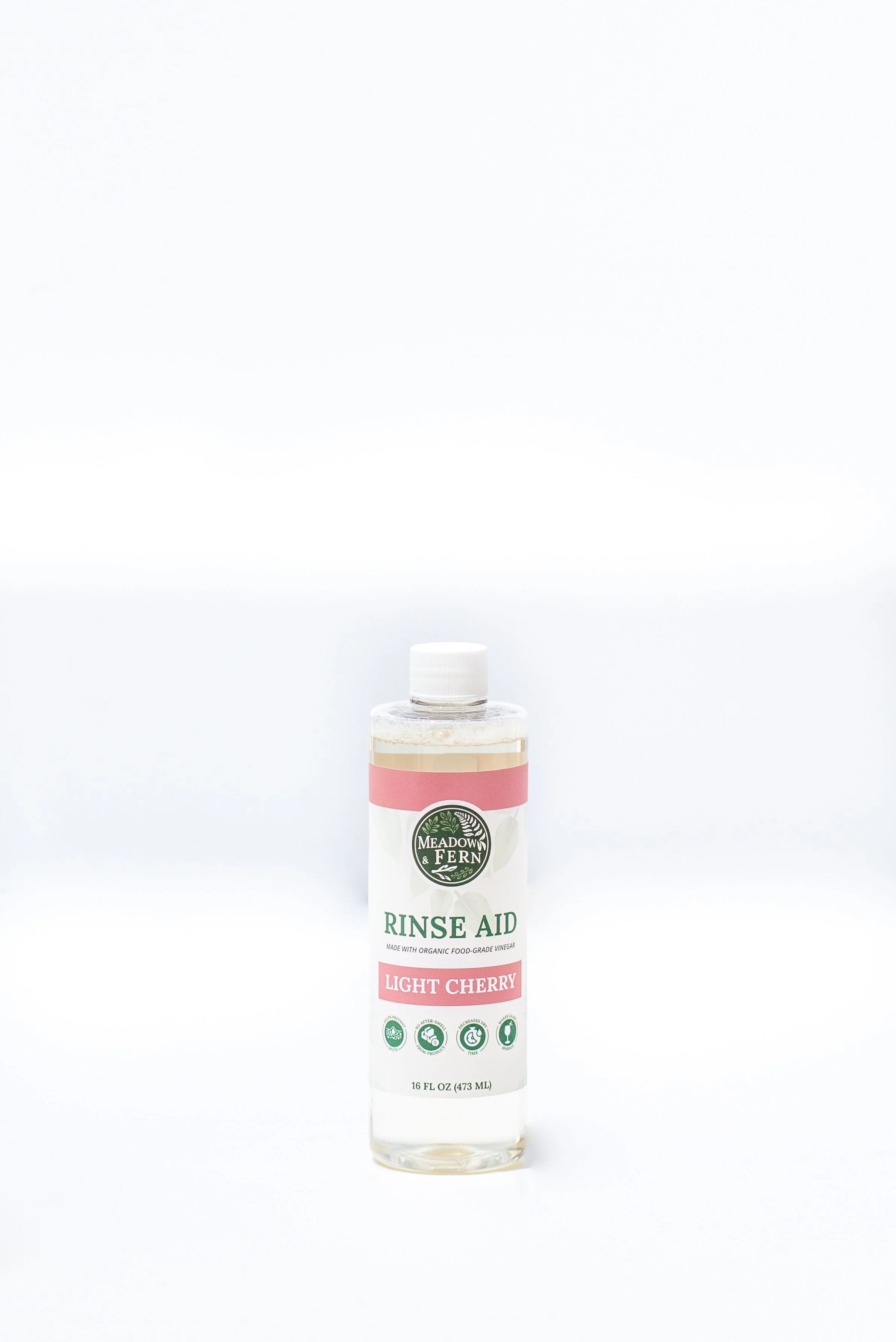A bottle of Meadow & Fern Light Cherry Rinse Aid against a plain white background.