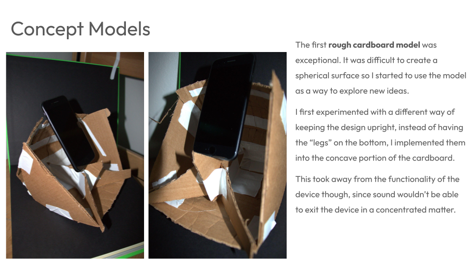 Two concept models made from rough cardboard, shaped to hold a smartphone, showing design experimentation.