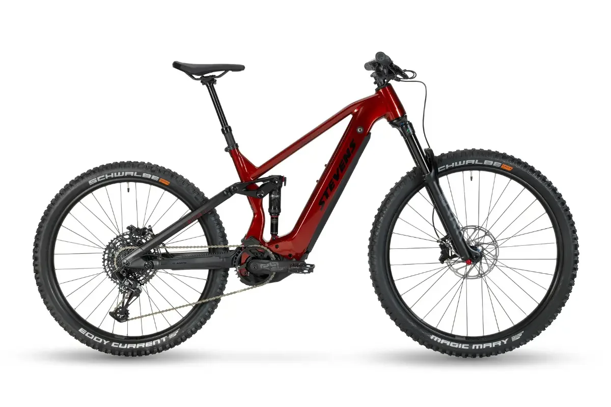 A red e-mountain bike with black tires, distinctive frame, front and rear suspension, standing upright against a white background.
