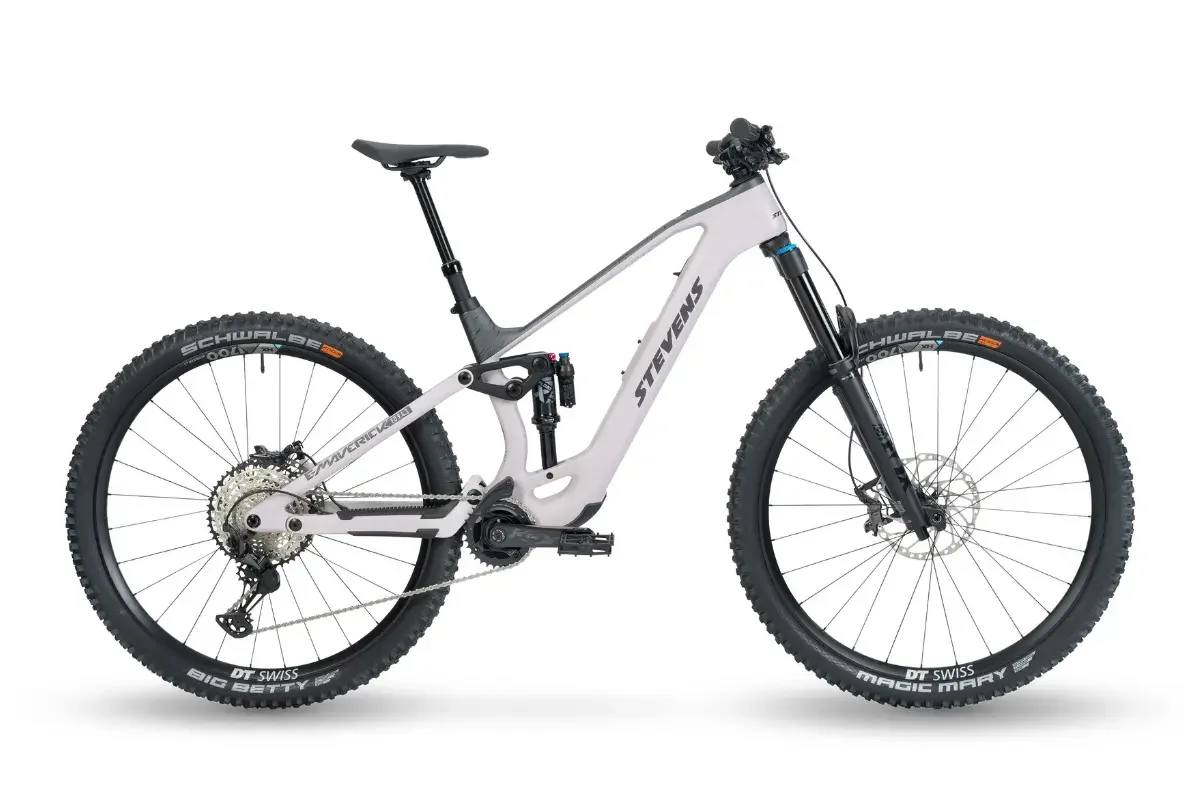 An electrically powered mountain bike with a white frame, black tires and suspension