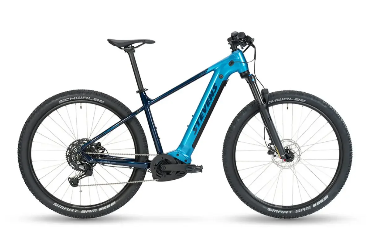 A blue electric bike with black tires and a black saddle on a white background.