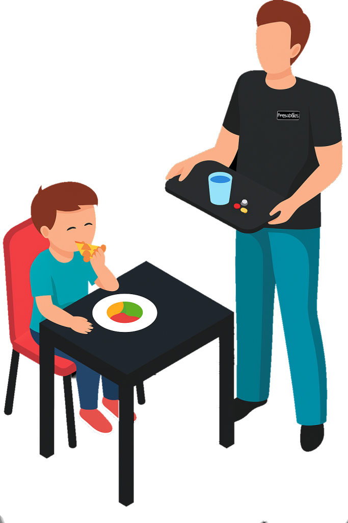 A young boy sitting at a table eating pizza while a woman, possibly a caregiver, is holding a tray with a glass of water and some pills.