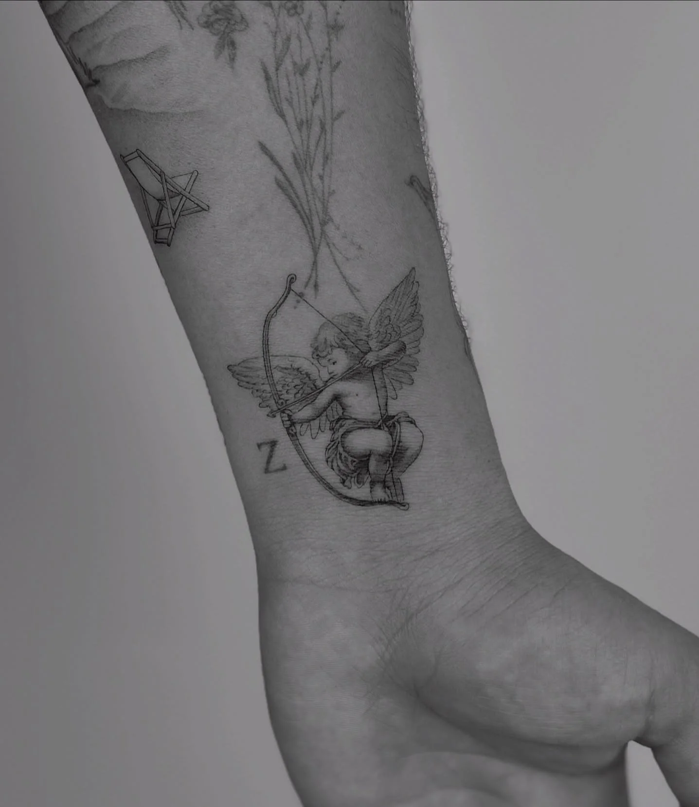 👼🏻 🏹 for Max. 
He wanted to fill in this tiny space on his wrist so we decided on a classic cherub. ~ 2.5 inches