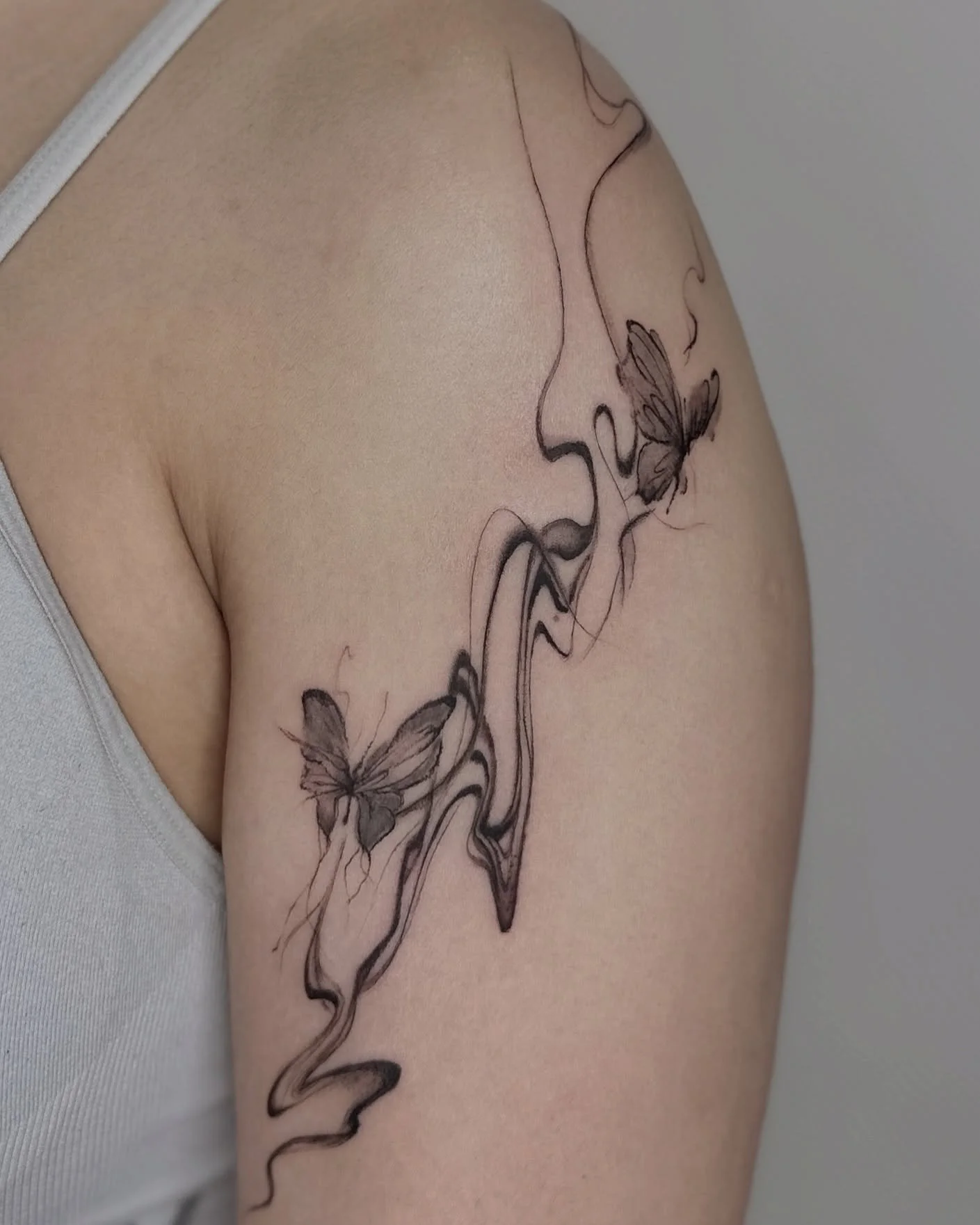 Chinese calligraphy style butterflies to honor her heritage 🦋