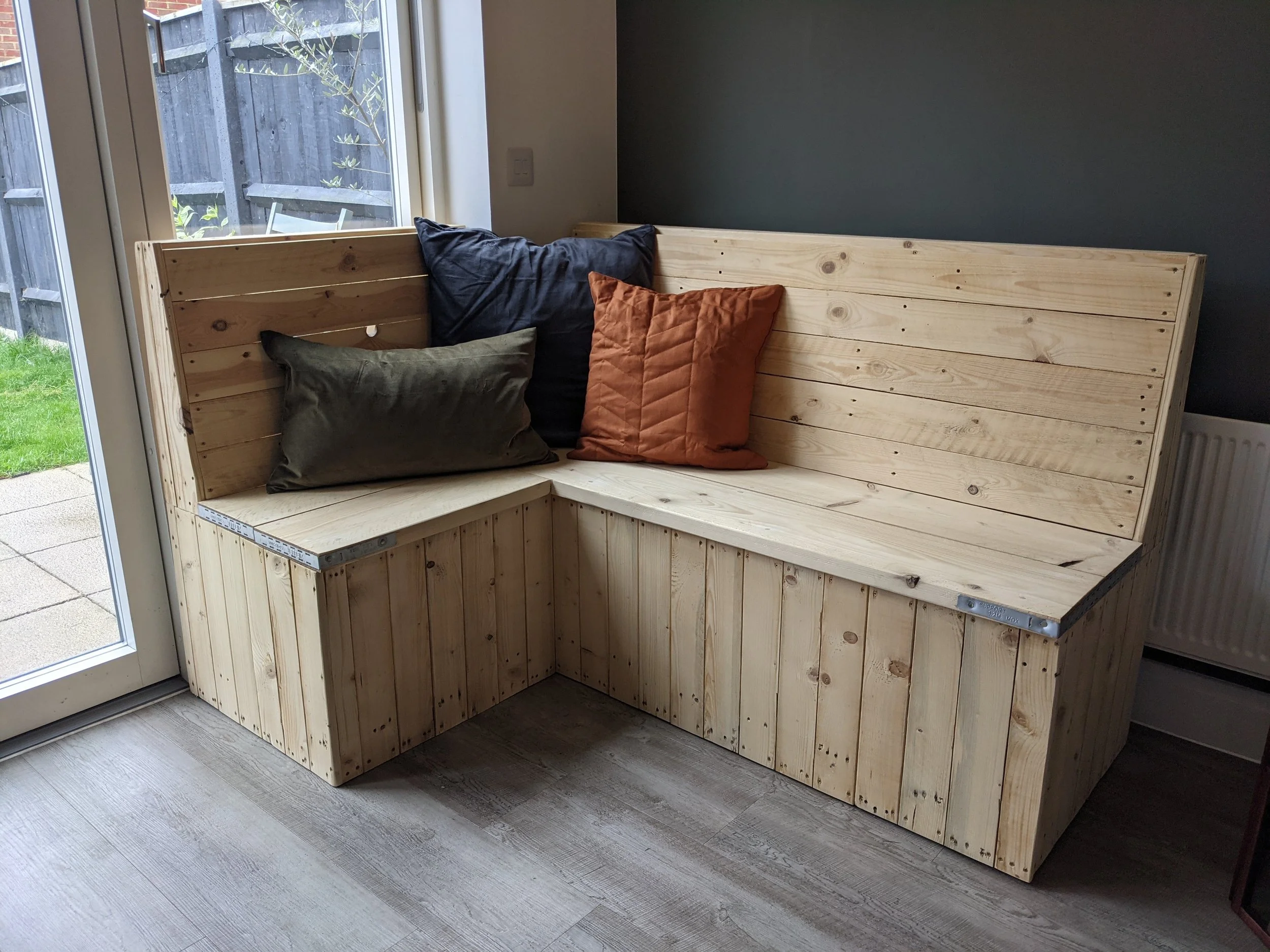 Dining bench with storage to fit around a round table already owned. Making better use of the space. 