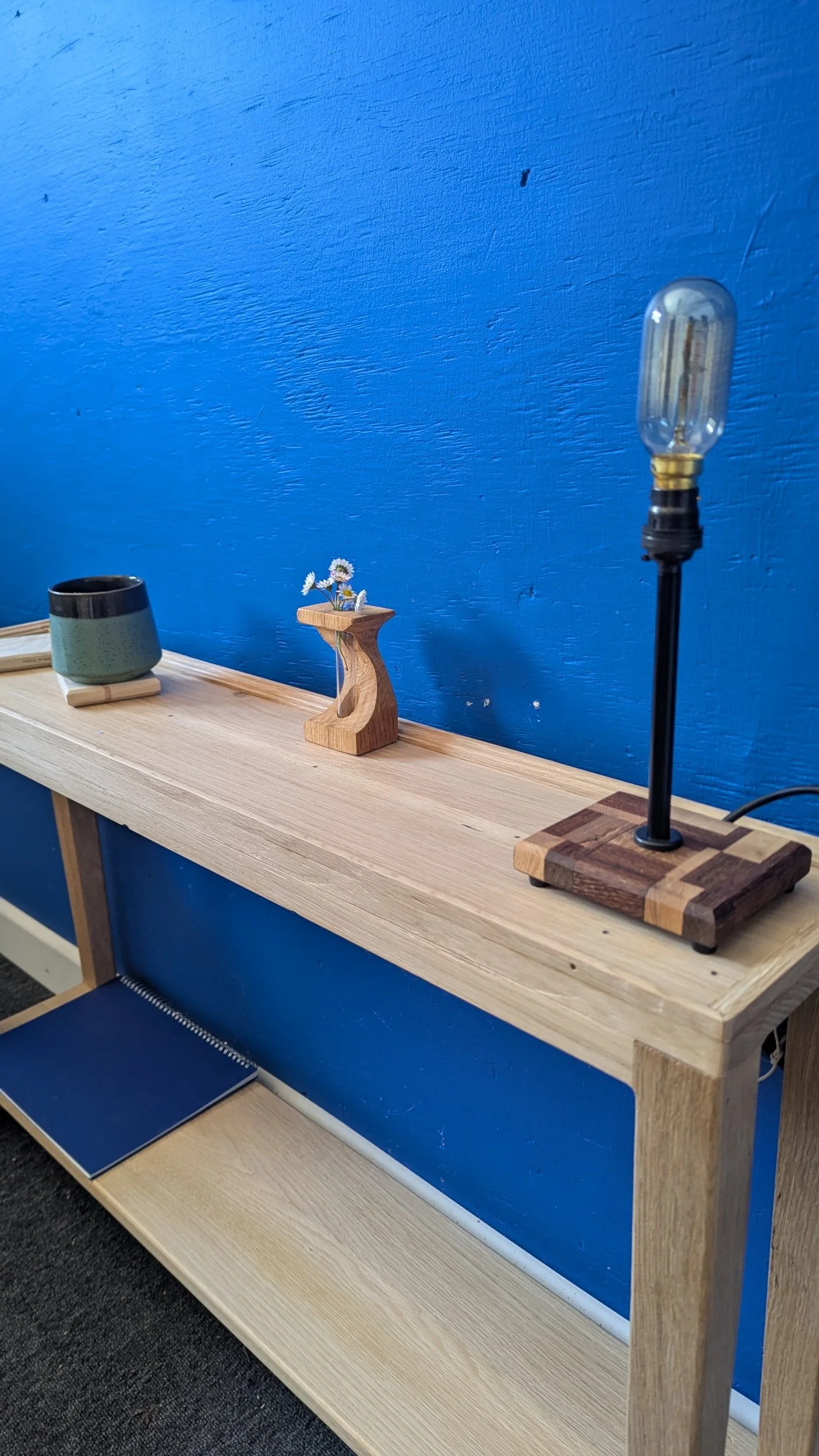 Created from an old fireplace, this customer asked for a slim side table to fit beside their sofa. With top edging, tapered legs and second shelf all adding to their cosy home.
