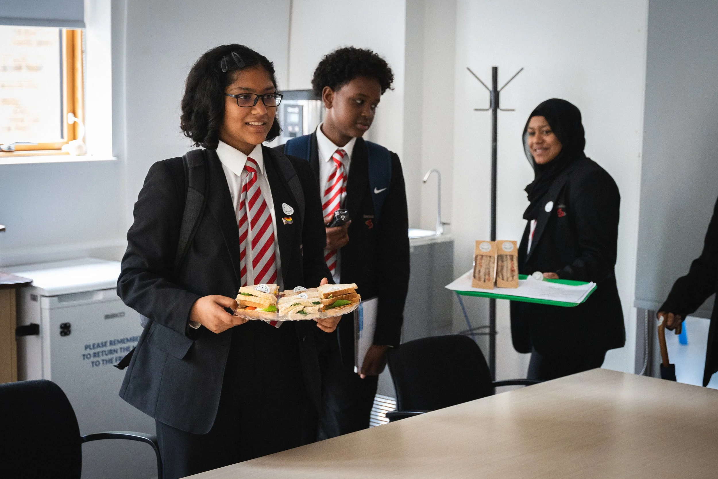 Young people delivering sandwiches