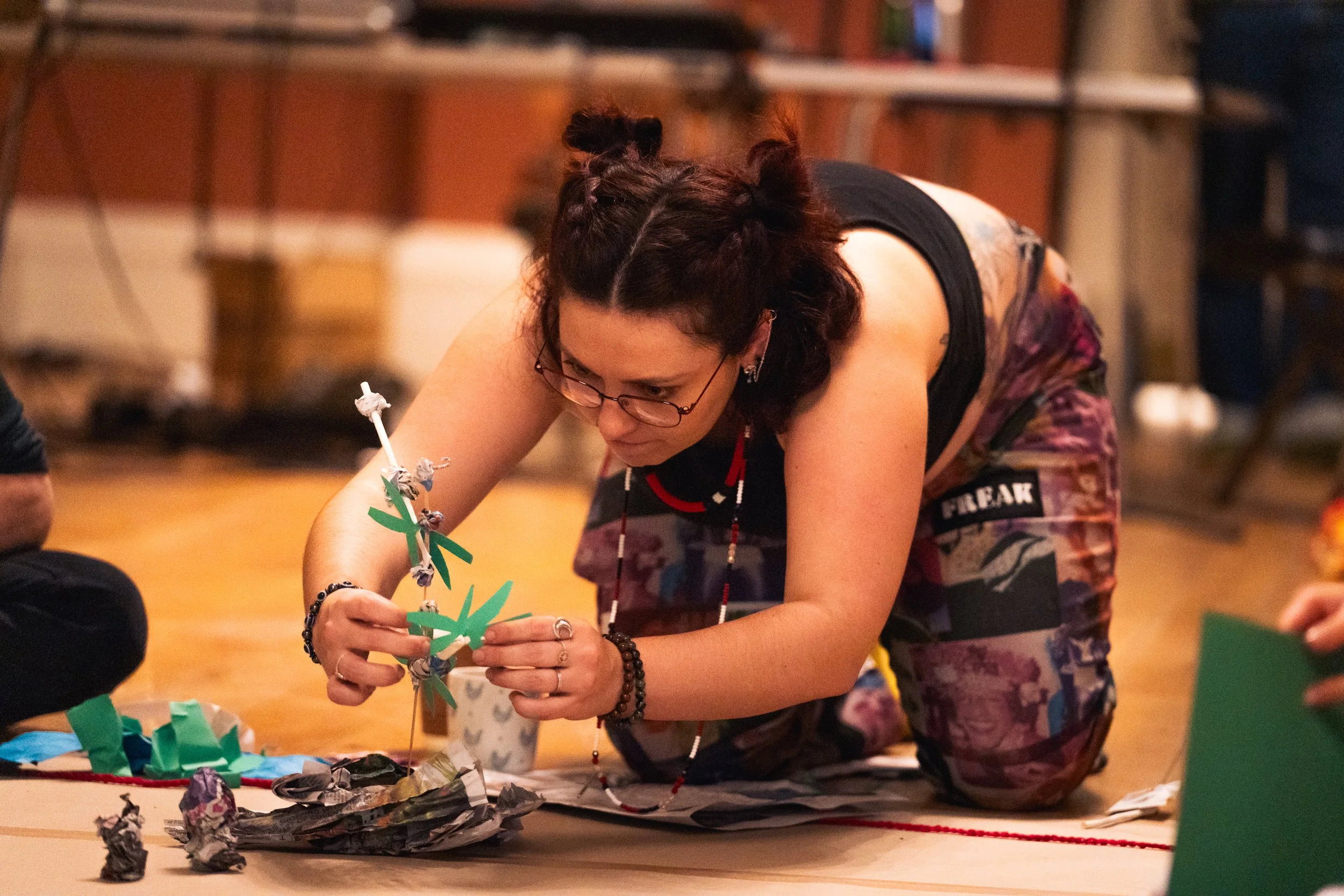 A woman makes something with her hands