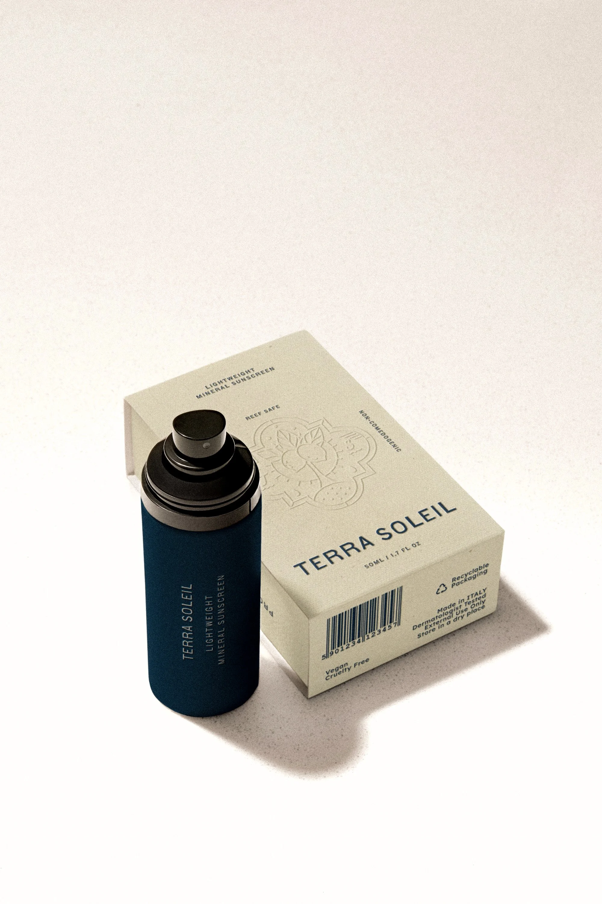 Terra Soleil lightweight mineral sunscreen spray with beige packaging and blue bottle.