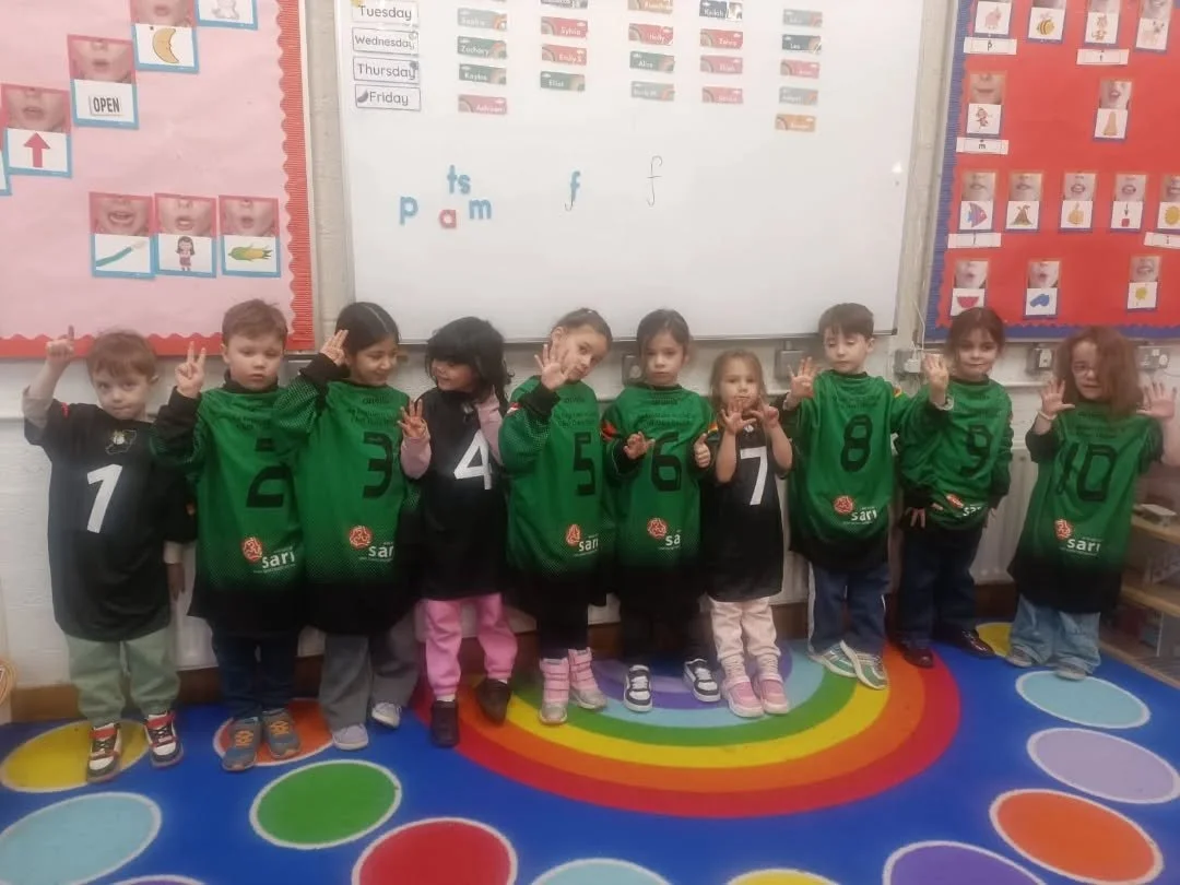 Orla's Junior Infants had great fun wearing our school jerseys for maths this week. First they found a friend with the same number, then they found the number that comes before/after their number and finally they made a big number line!