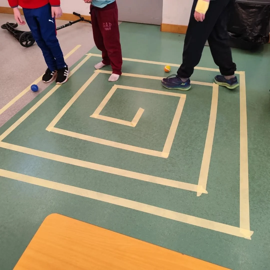 Morning activity in Peter's class, get the ball through the maze.