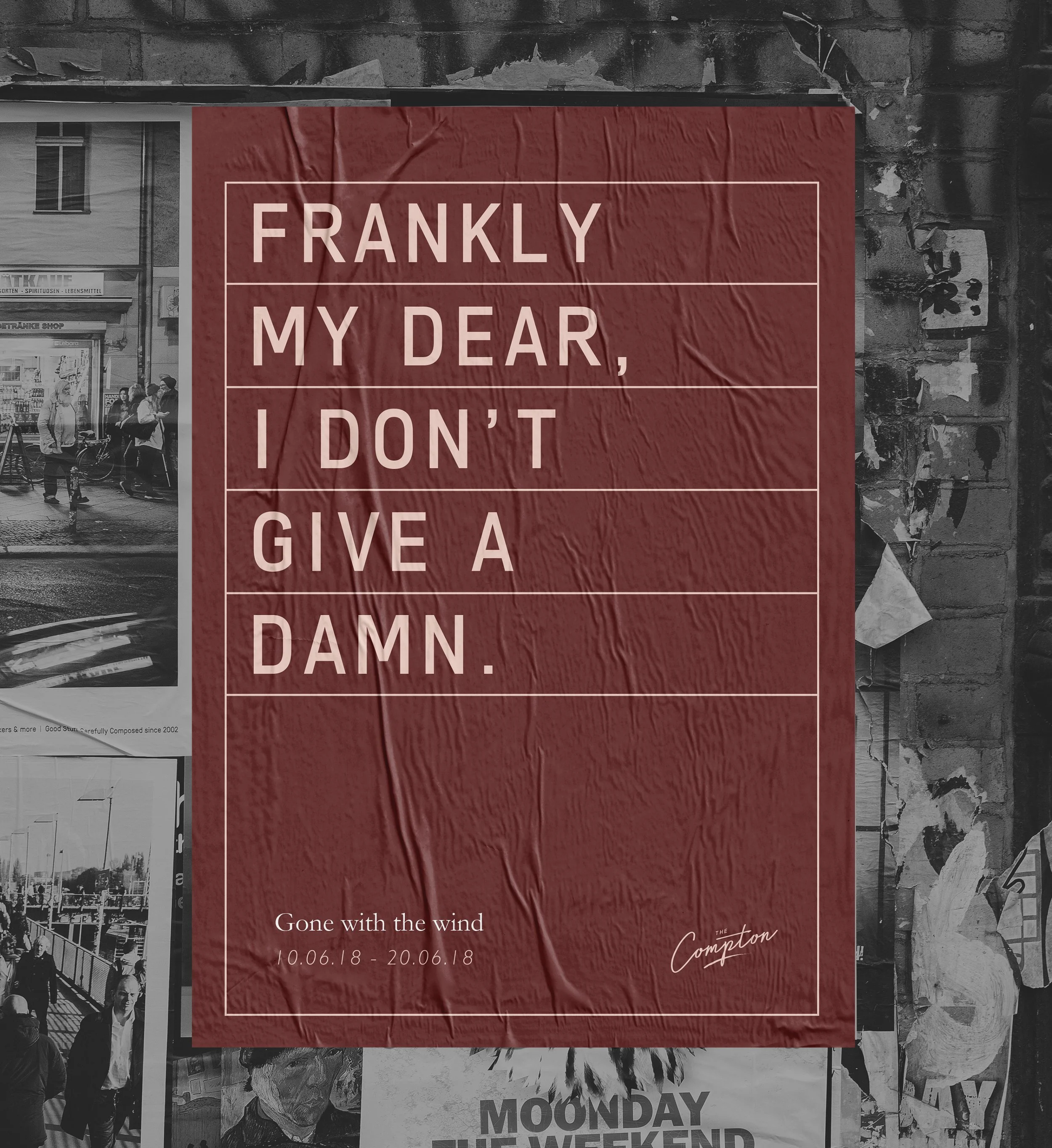 Red poster with white text that reads, 'Frankly my dear, I don't give a damn.' Beneath it, smaller text says, 'Gone with the wind 10.06.18 - 20.06.18' and the name 'The Compton.' The poster is attached to a rough, textured wall with some torn paper and other pictures around it.