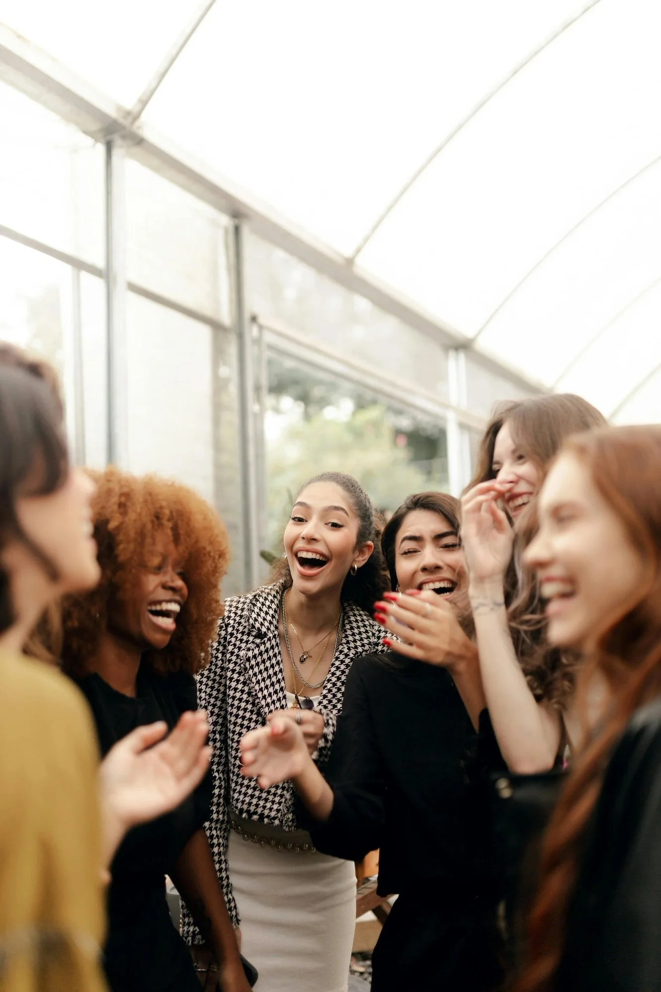group of women laughing and singing