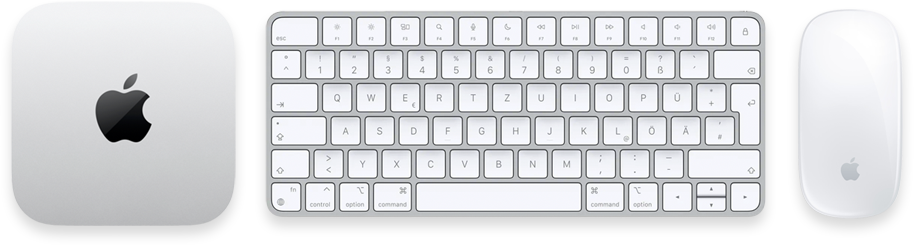 Ein Apple-Computer, eine kabellose Tastatur und eine kabellose Maus auf einem weißen Hintergrund.