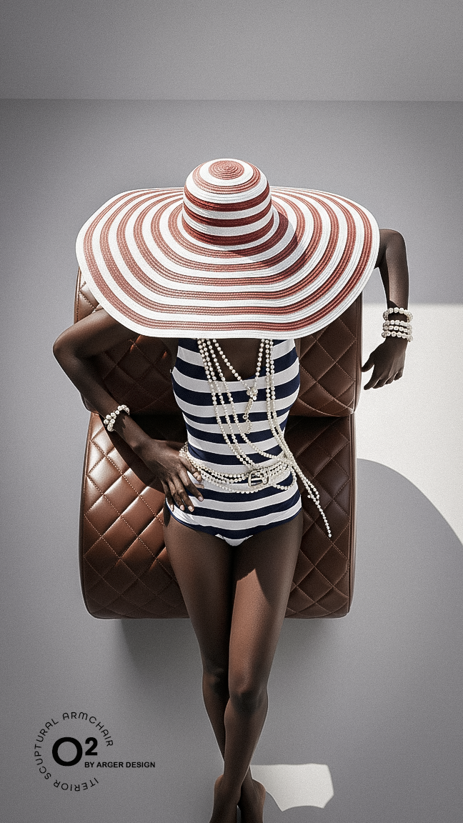 A woman wearing a large striped sun hat, navy and white striped swimsuit, multiple pearl necklaces, and pearl bracelets, lounging on a brown quilted, round chair in a minimal gray setting.