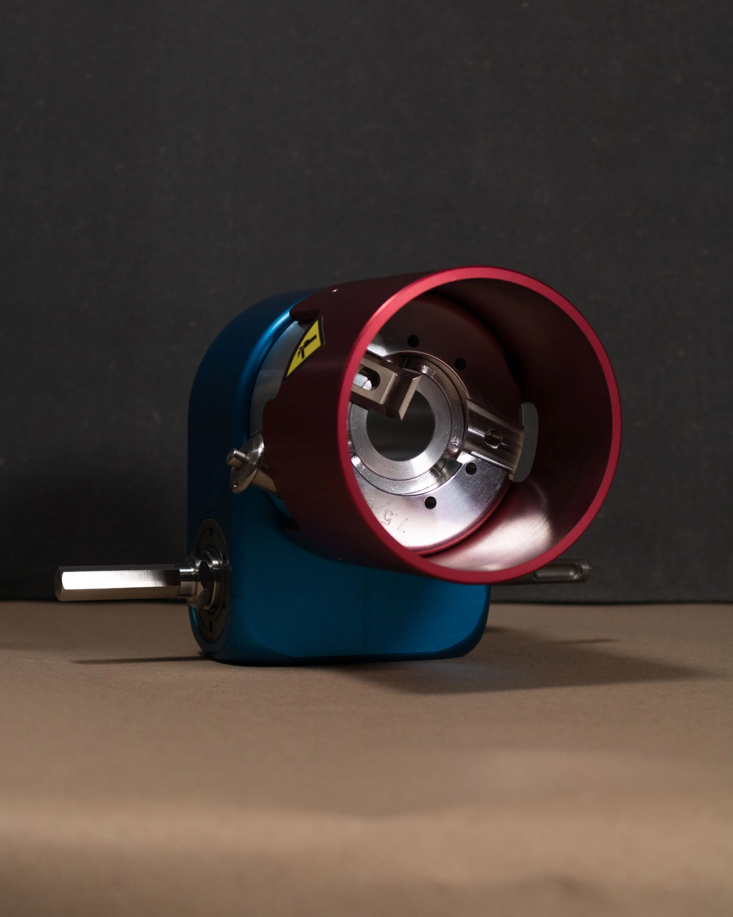 A Global Cable fibre cable stripper against a dark background.