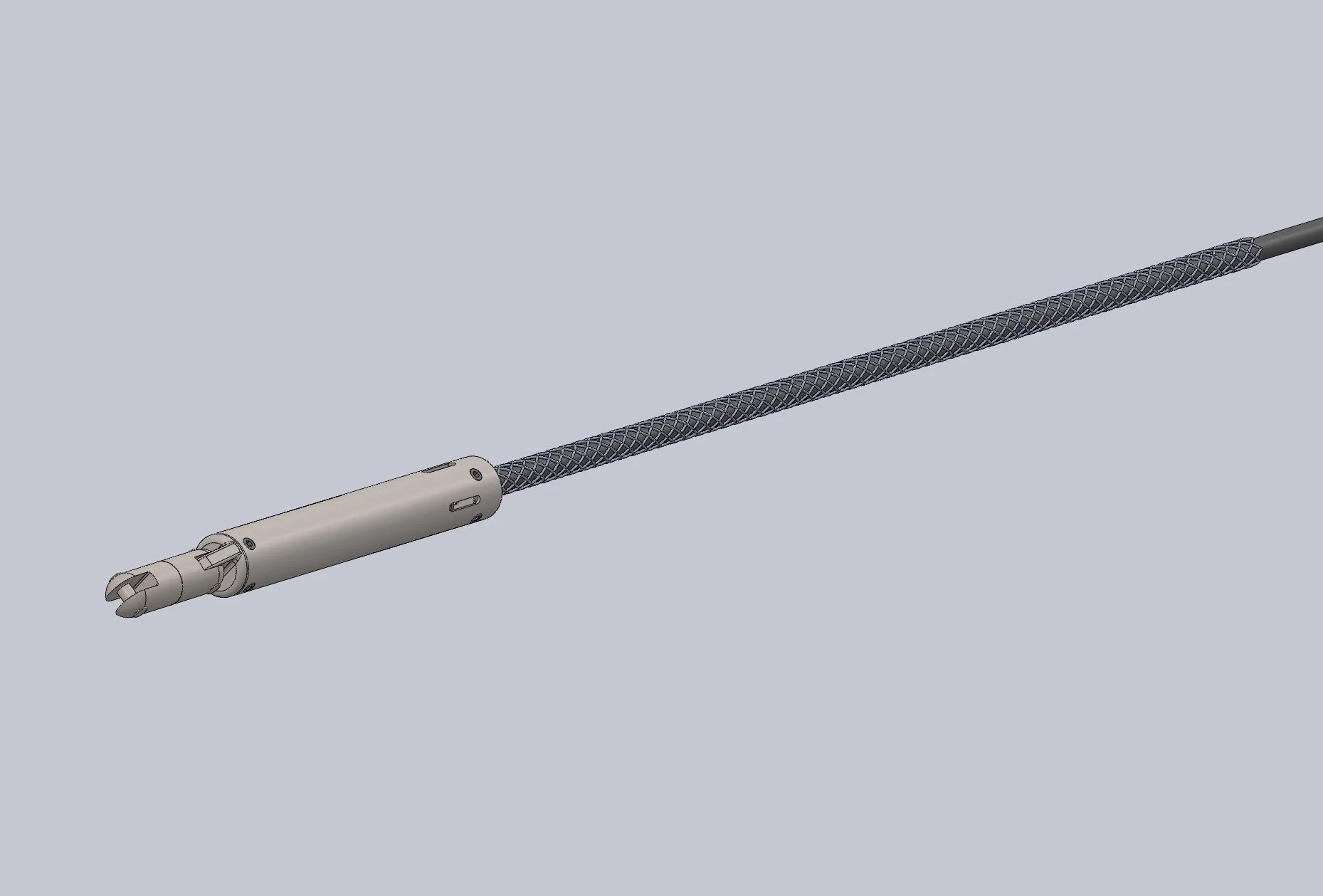 A medical device with a long, thin, textured tube attached to a cylindrical handle with a mechanical tip.