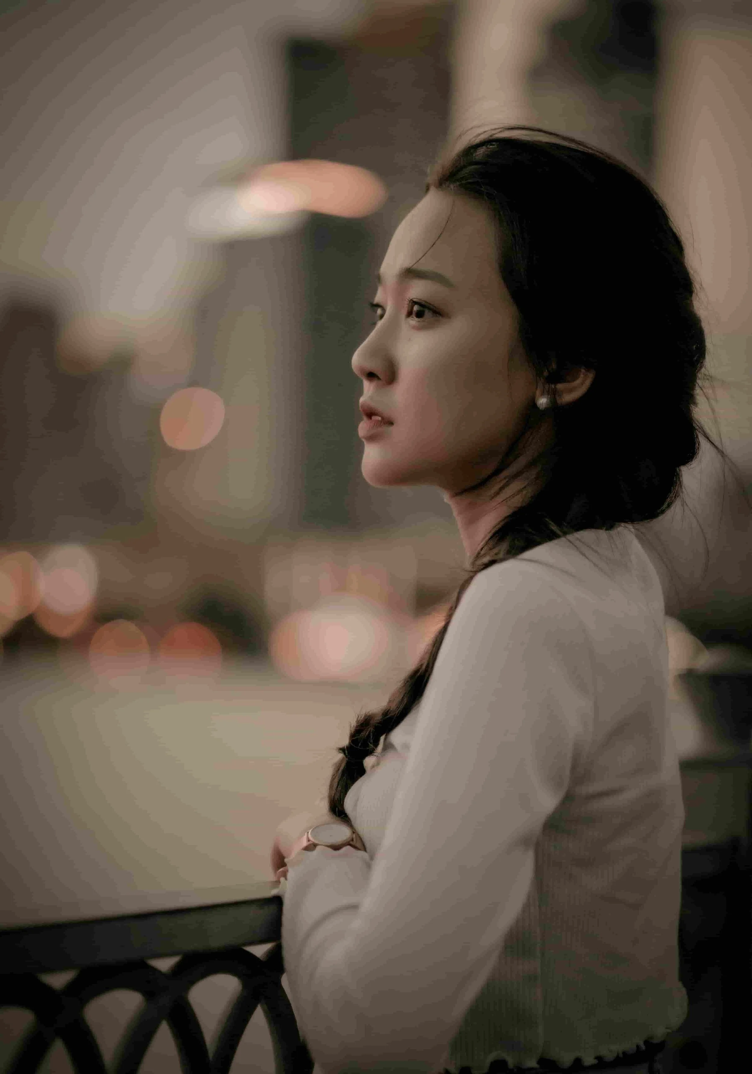 Woman overlooking the city and feeling unfulfilled in life