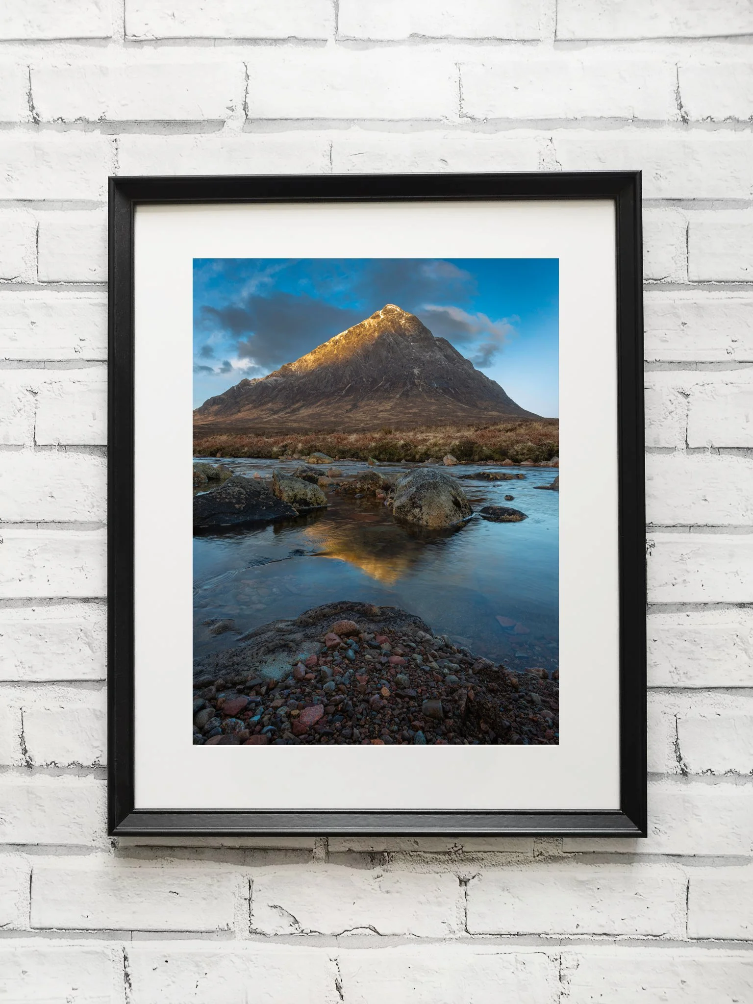 Photograph of Bauchaillie Etive More Mountain in Glen Coe Scotland just as the sun starts to hit the side of the mountain at sunrise.