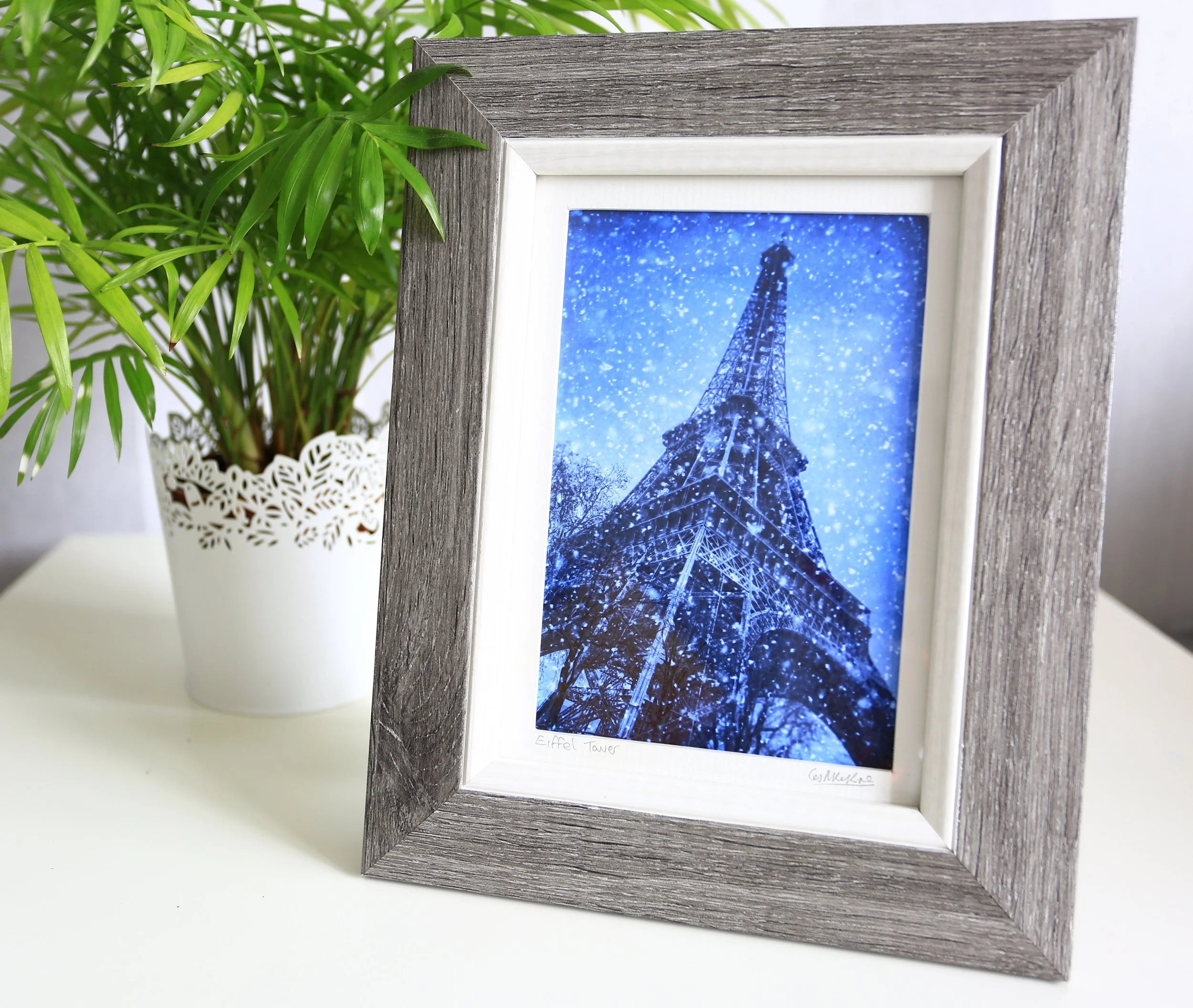 Framed Photo of The Eiffel Tower in The Winter snow which would look good in your home or Business.