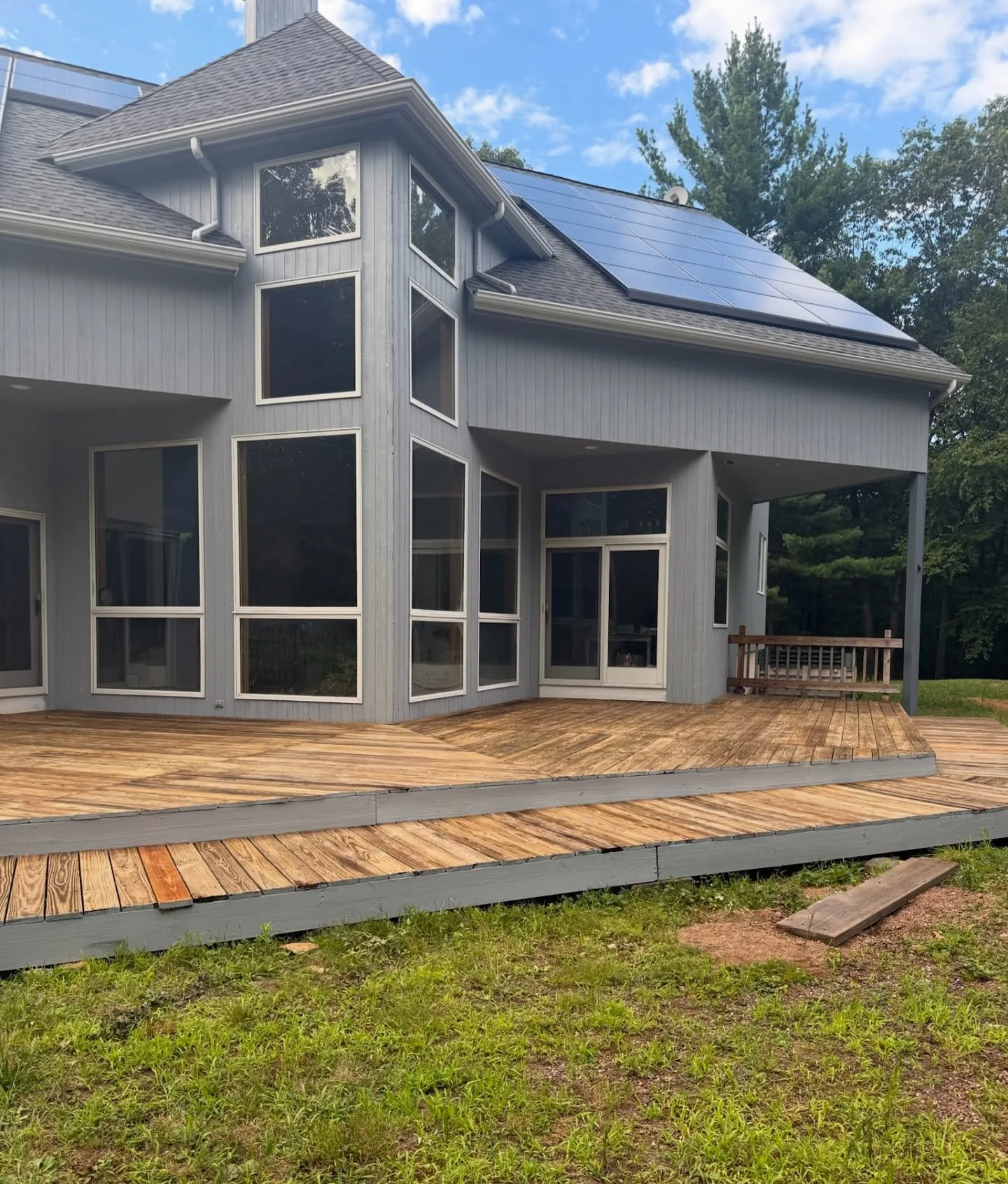 Talk about curb appeal ✨ We gave this home a full exterior refresh &mdash; starting with a complete wash, prep, and wood repairs. Then, two coats of solid stain on the walls, soffits, and fascia, and an Emerald finish on the doors and frames. Now thi
