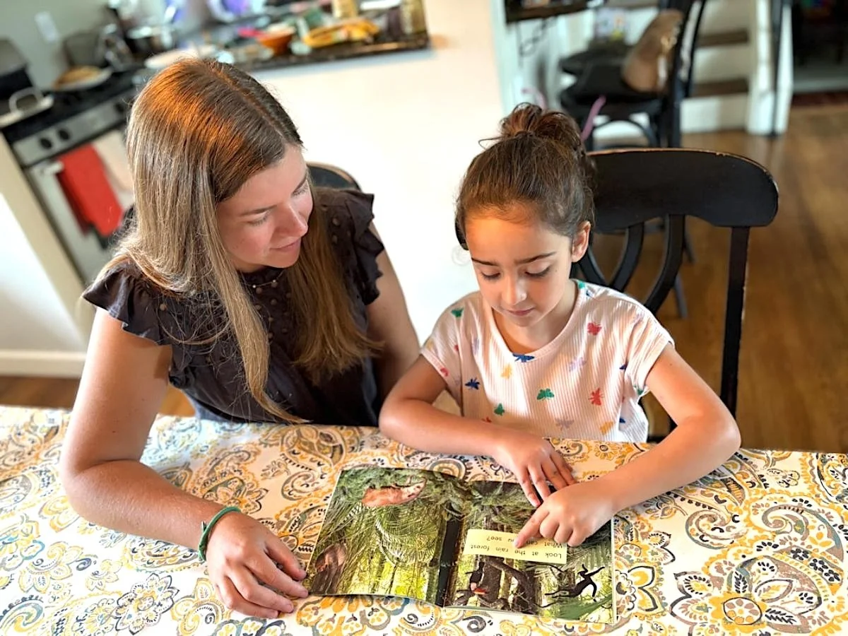 Alyssa Van Riper, founder of Build Them Up Tutoring helping a student with reading during a personalized tutoring session in Bedminster, NJ