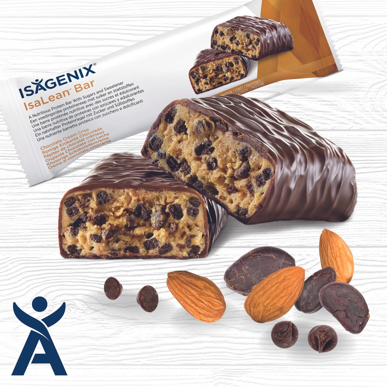 Chocolate chip protein bar with almonds and chocolate pieces on a white wooden surface, with packaging in the background.